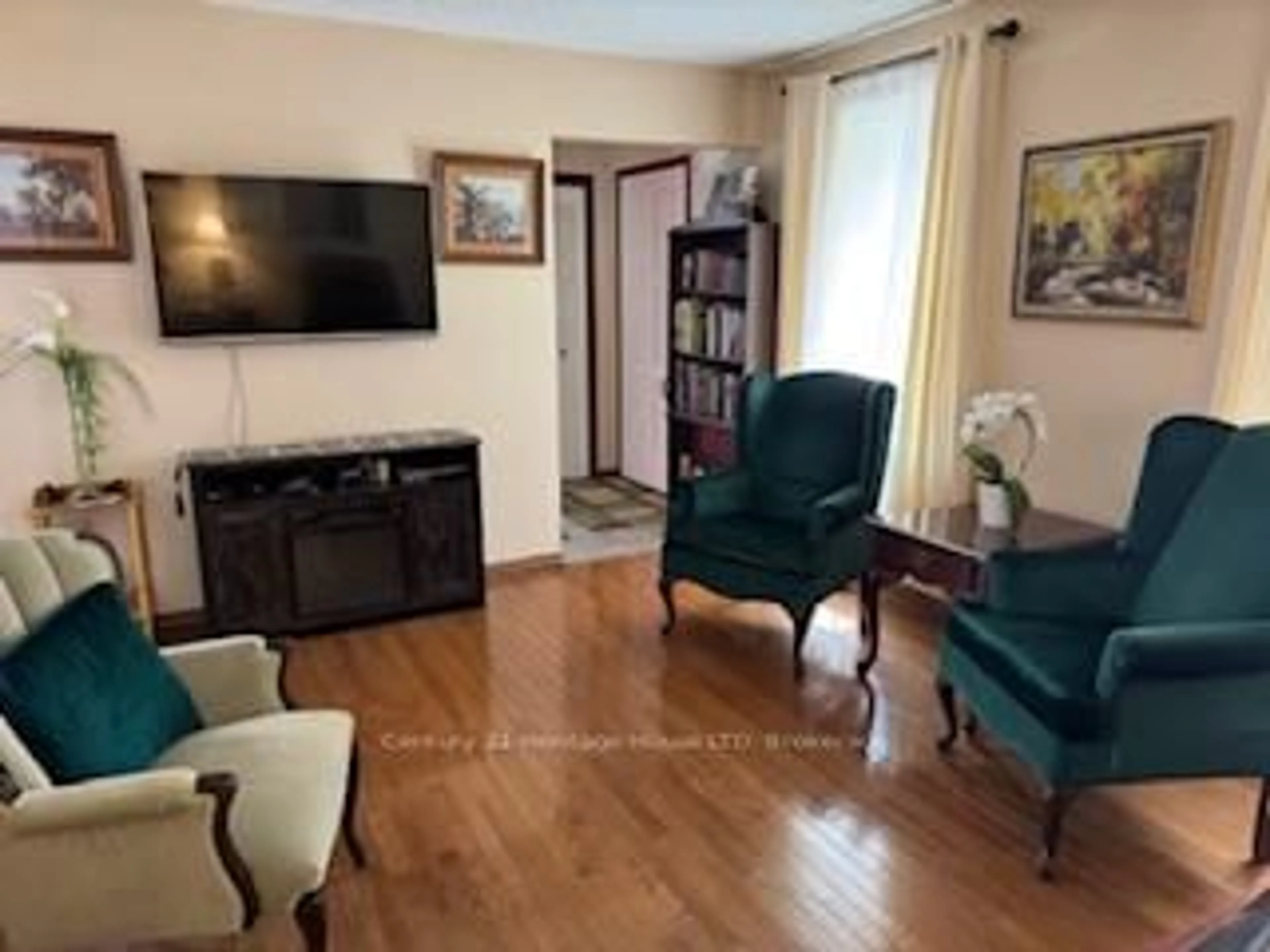 Living room with furniture, wood/laminate floor for 5638 Highland Ave, Niagara Falls Ontario L2G 4X1