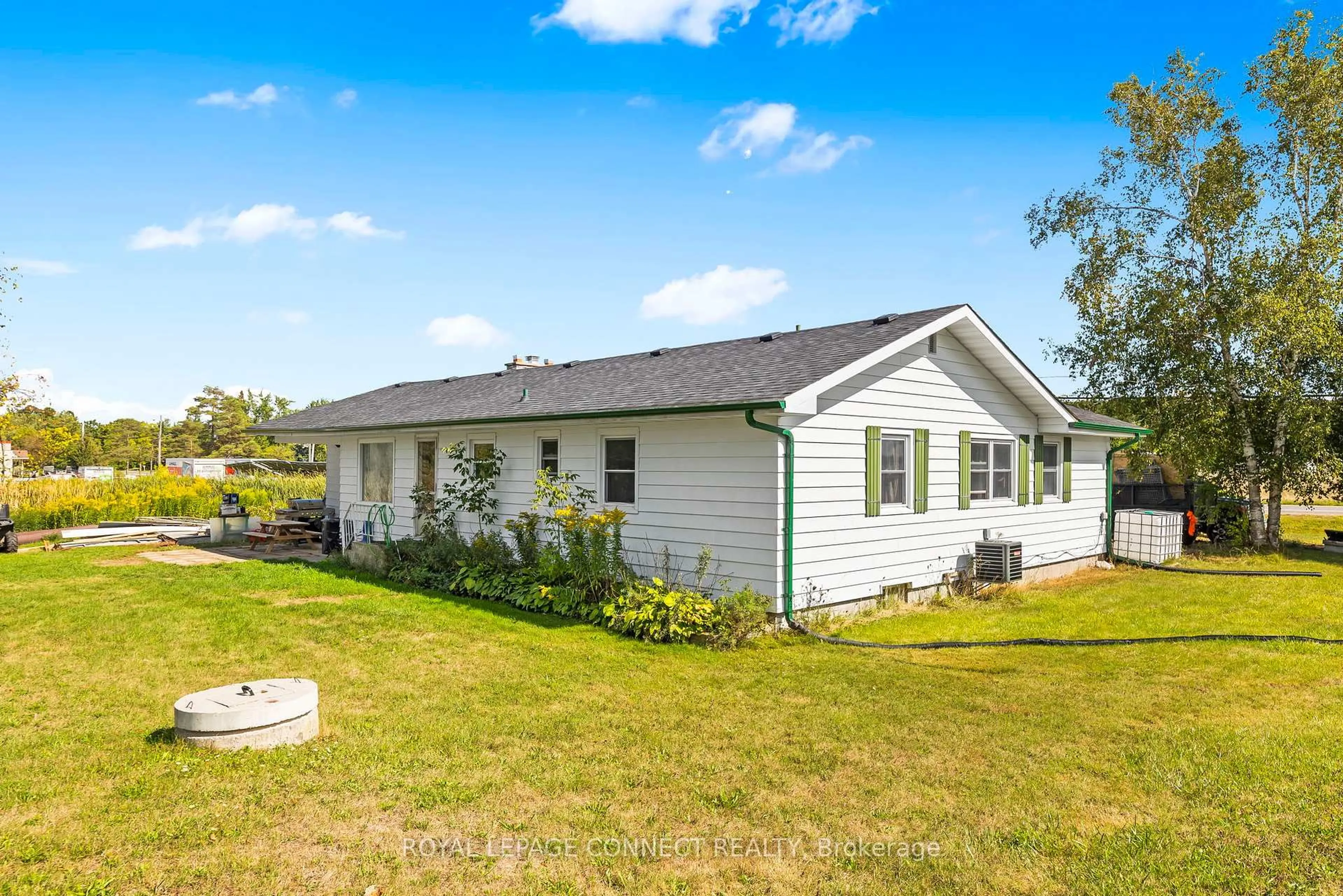 A pic from outside/outdoor area/front of a property/back of a property/a pic from drone, water/lake/river/ocean view for 174 County Rd 4 Rd, Douro-Dummer Ontario K9J 6Y2