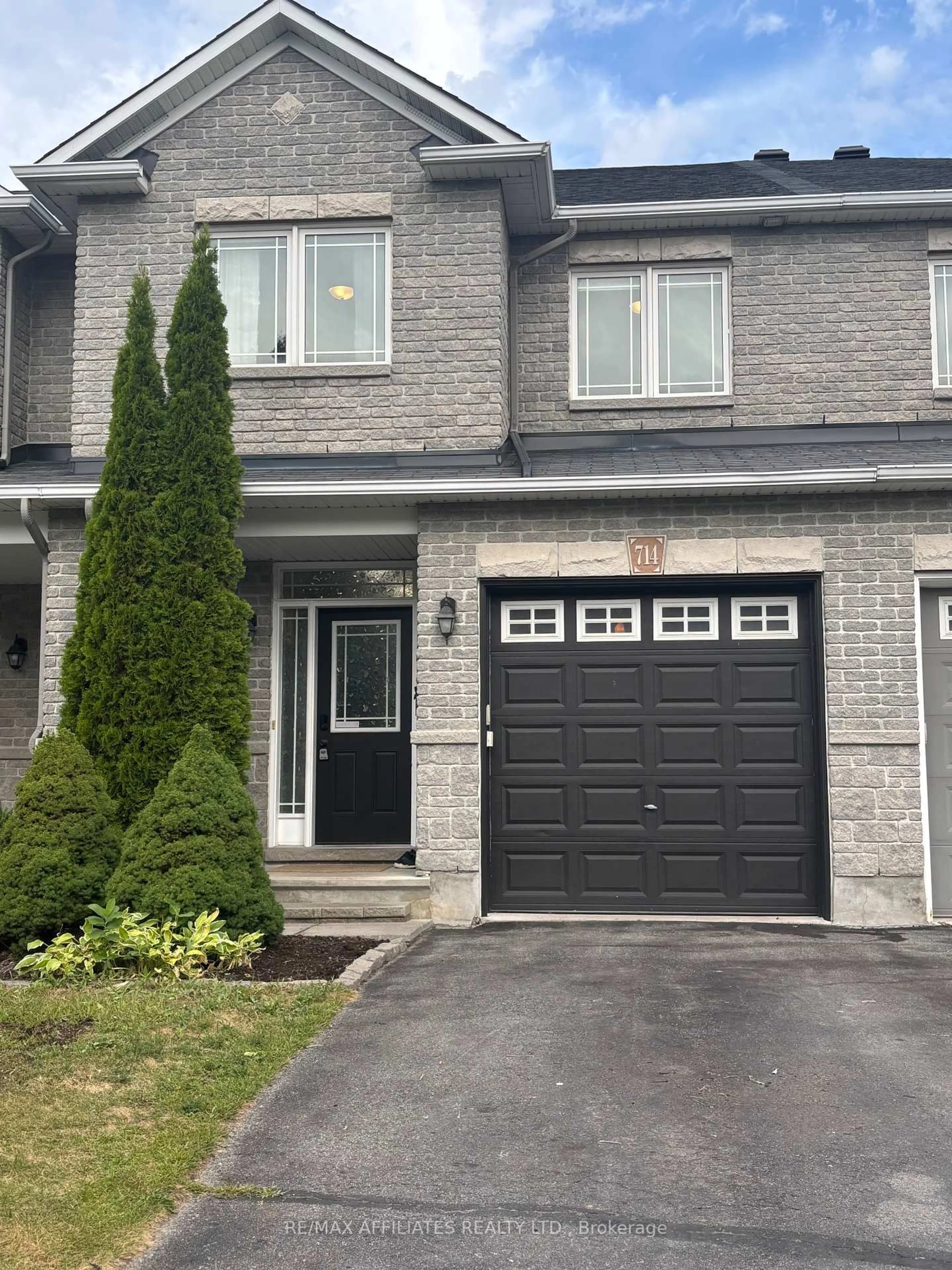 Home with brick exterior material, street for 714 Regiment Ave, Ottawa Ontario K2M 0E3