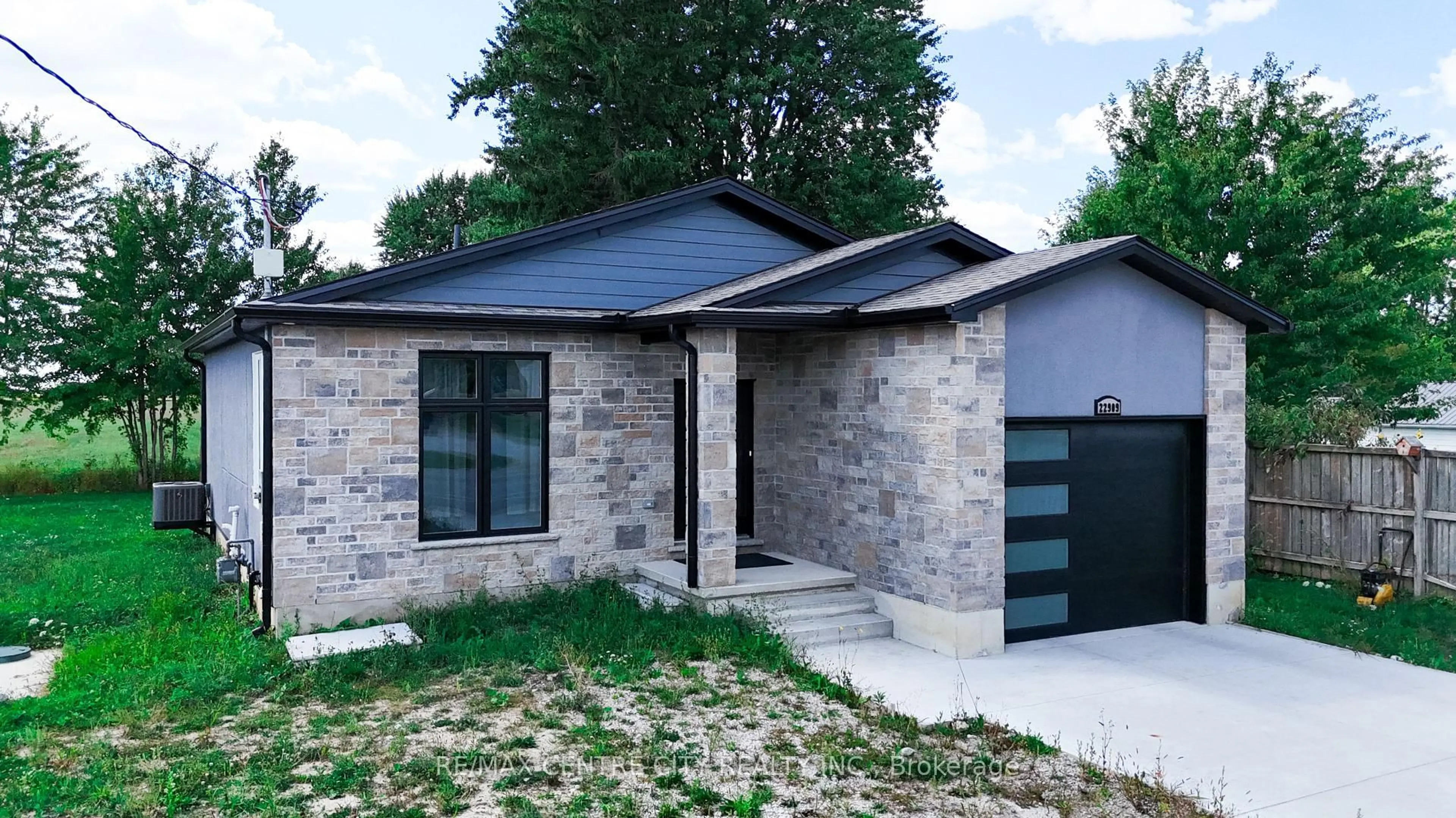 Home with brick exterior material, street for 22909 Highbury Ave, Middlesex Centre Ontario N0M 2A0