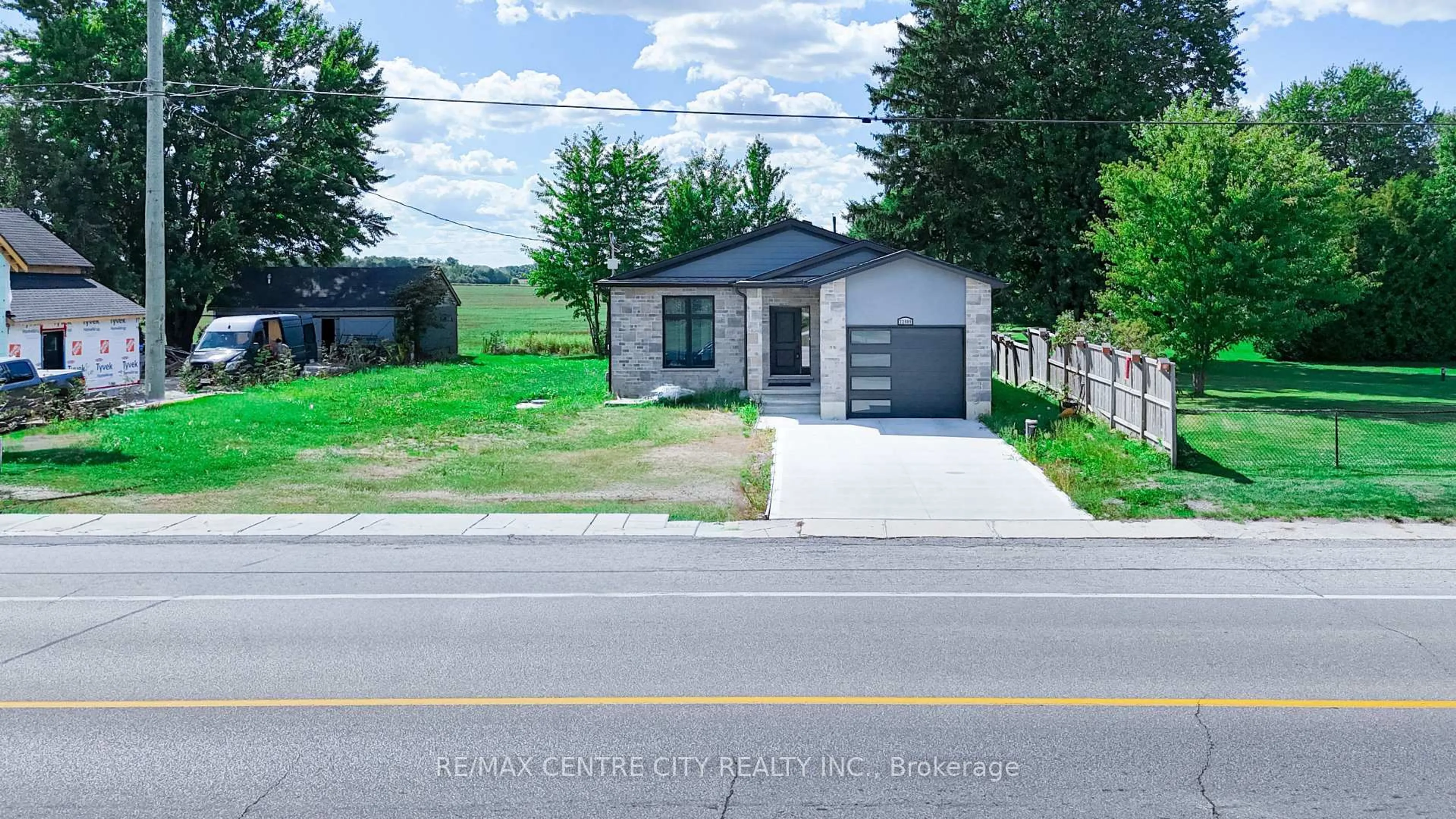 A pic from outside/outdoor area/front of a property/back of a property/a pic from drone, street for 22909 Highbury Ave, Middlesex Centre Ontario N0M 2A0