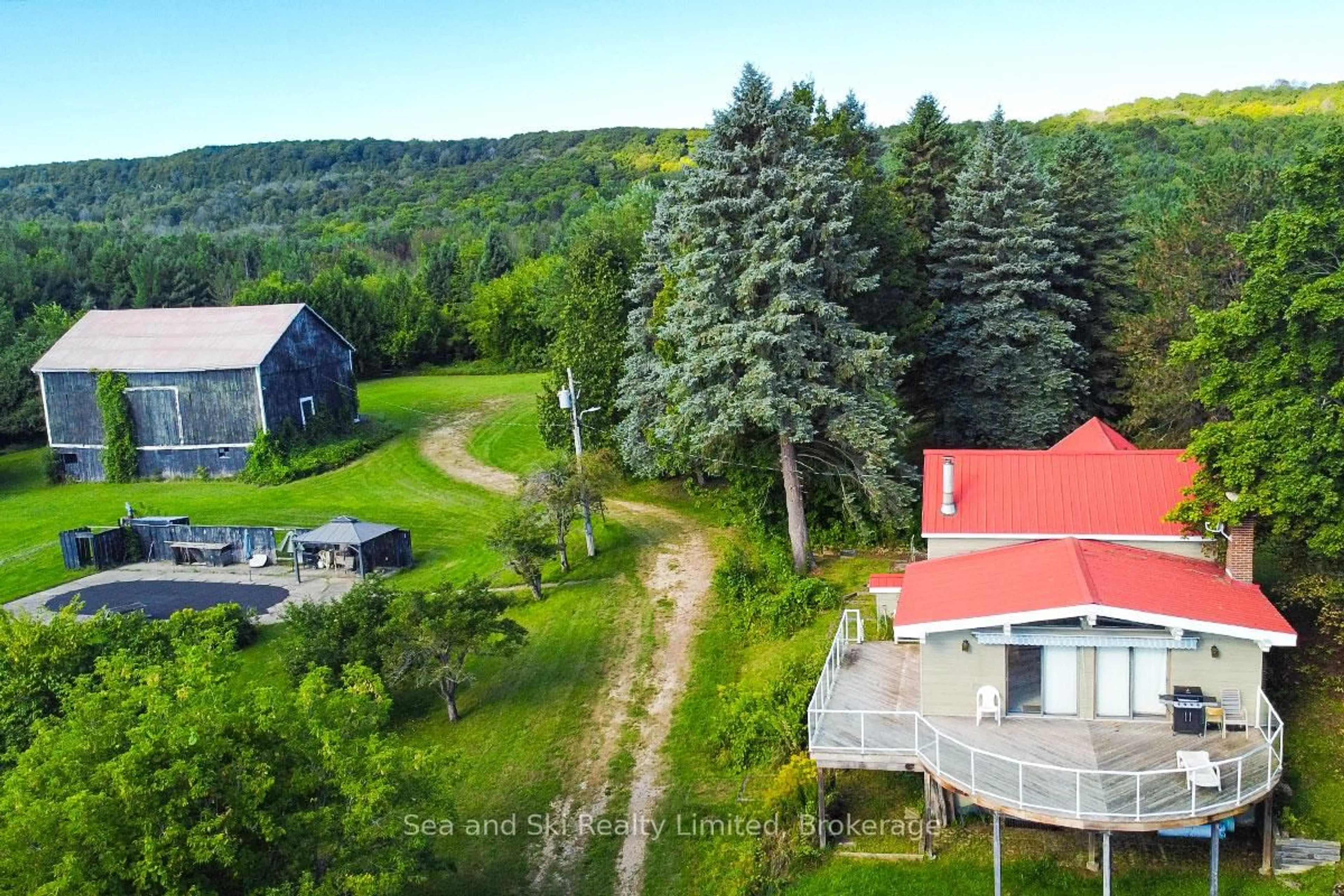 A pic from outside/outdoor area/front of a property/back of a property/a pic from drone, unknown for 195908 Grey Road 7 Rd, Grey Highlands Ontario N0C 1G0