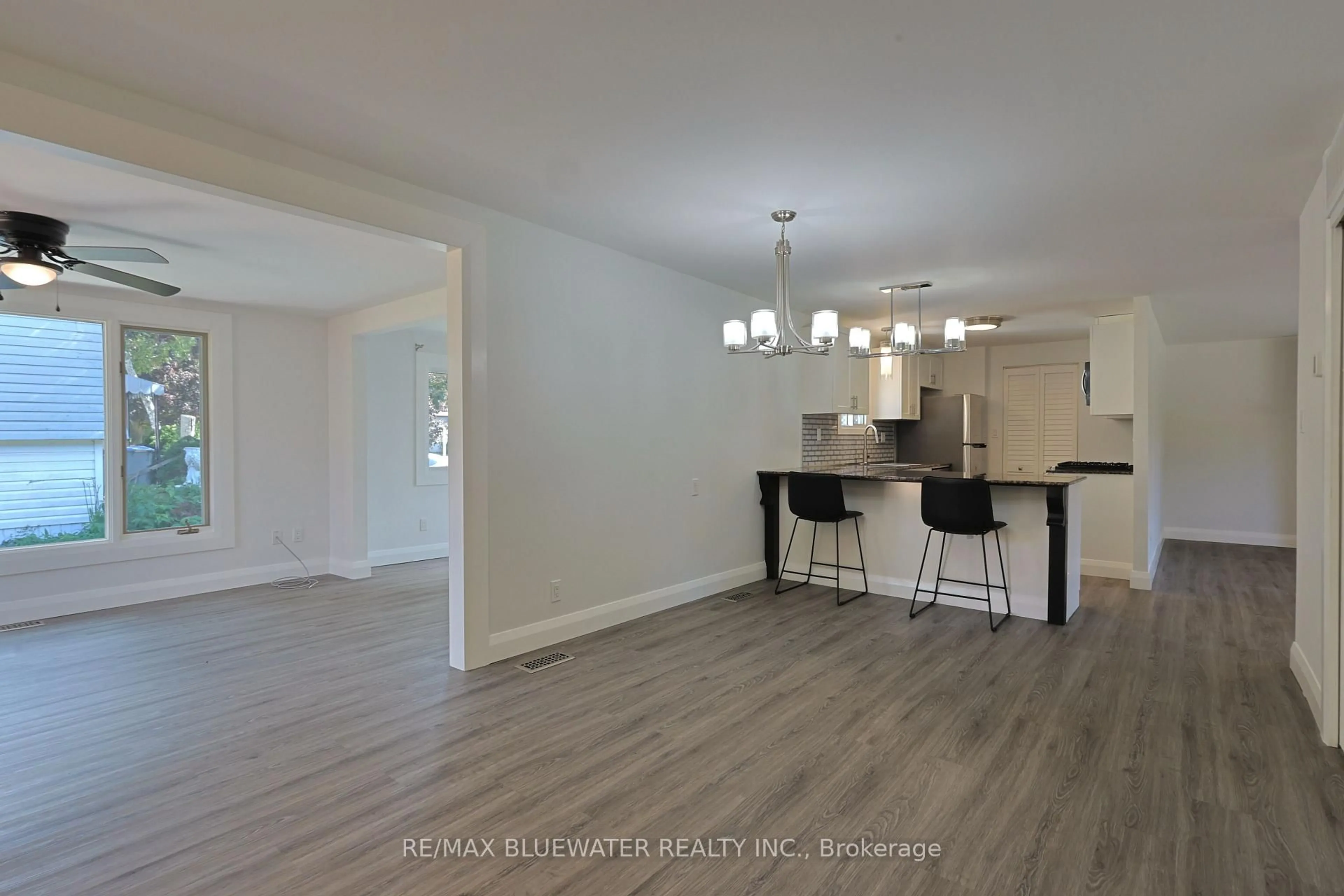 Open concept kitchen, wood/laminate floor for 34 Pebble Beach Pkwy, South Huron Ontario N0M 1T0