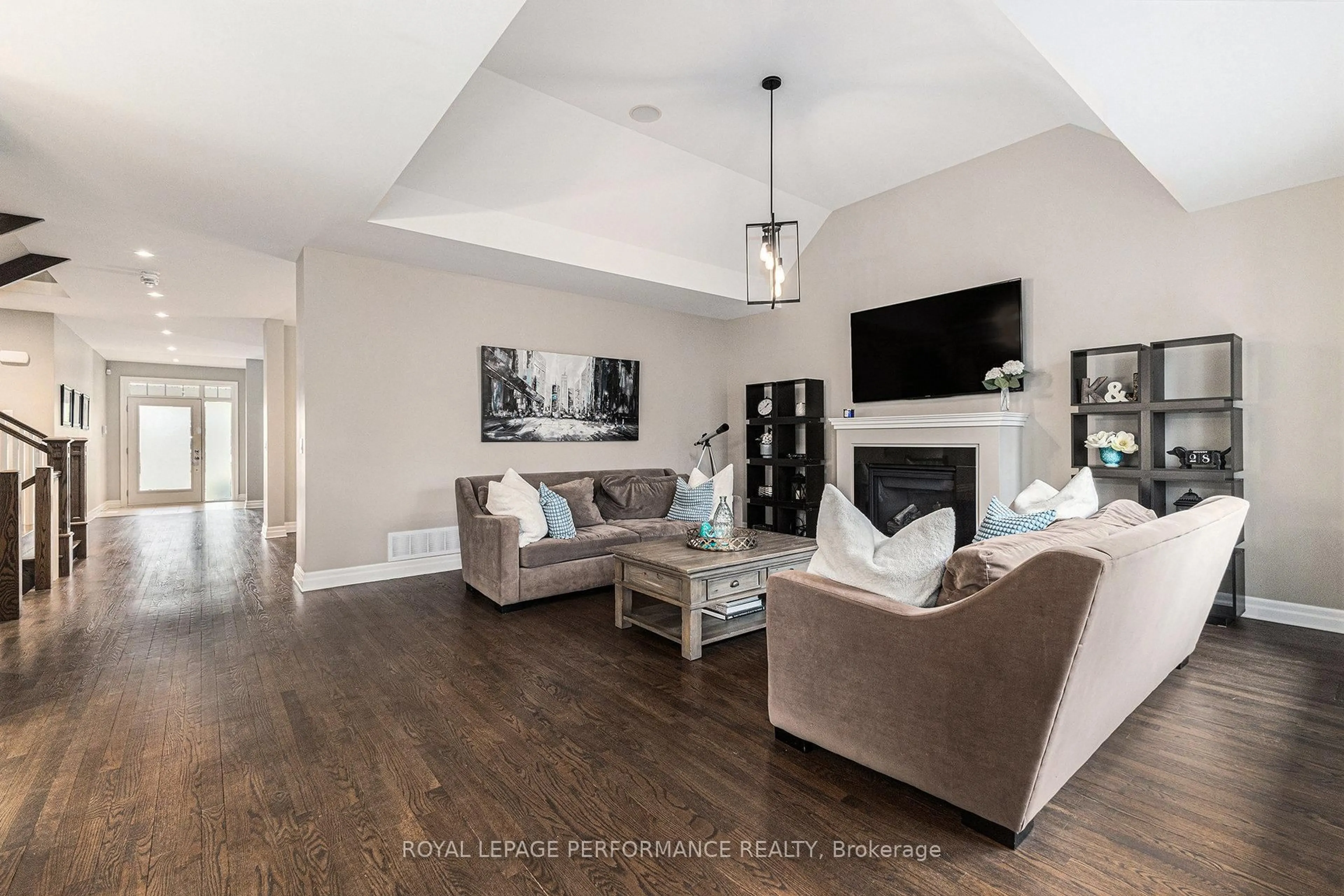 Living room with furniture, wood/laminate floor for 196 Grainstone Way, Kanata Ontario K2T 0H2