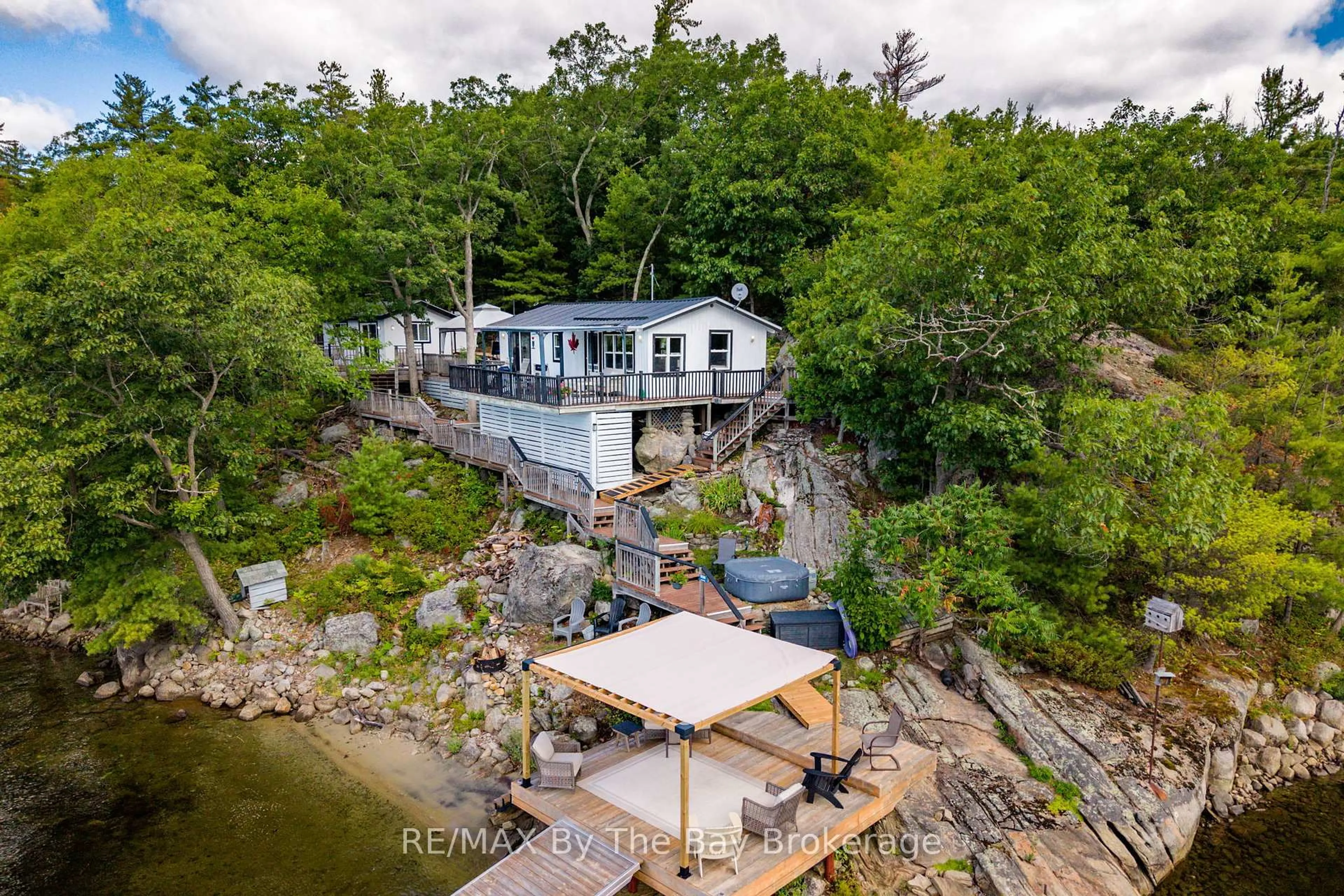 A pic from outside/outdoor area/front of a property/back of a property/a pic from drone, water/lake/river/ocean view for 18588 Georgian Bay Shore, Georgian Bay Ontario P0E 1E0
