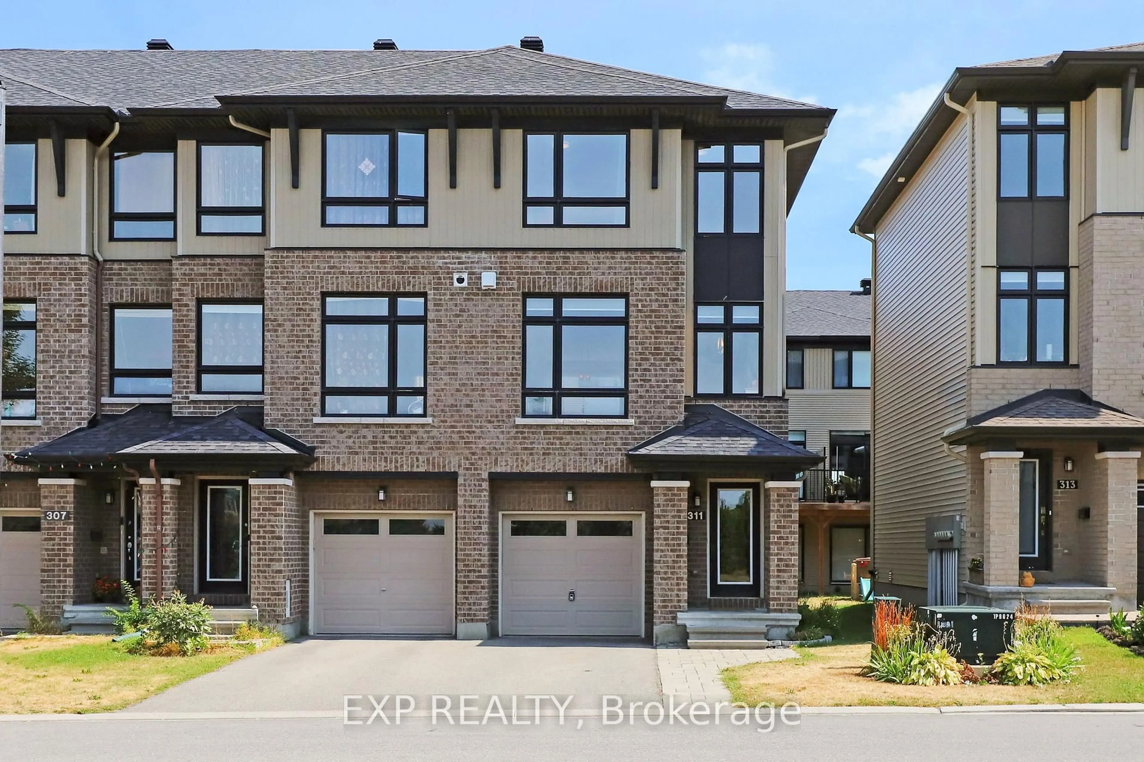 Home with brick exterior material, street for 311 Twinflower Way, Ottawa Ontario K2J 5B2