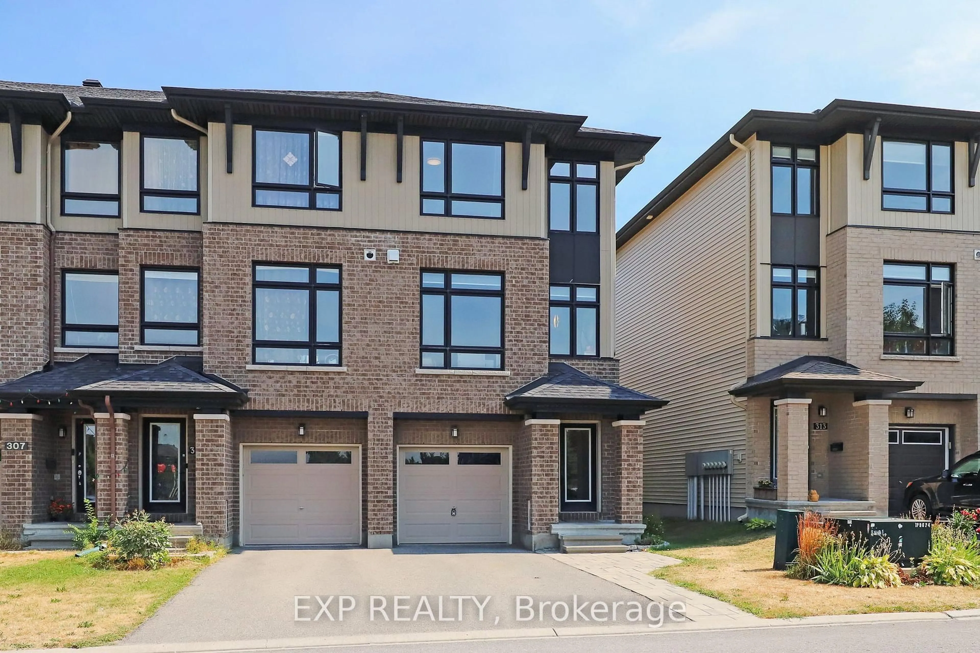Home with brick exterior material, street for 311 Twinflower Way, Ottawa Ontario K2J 5B2