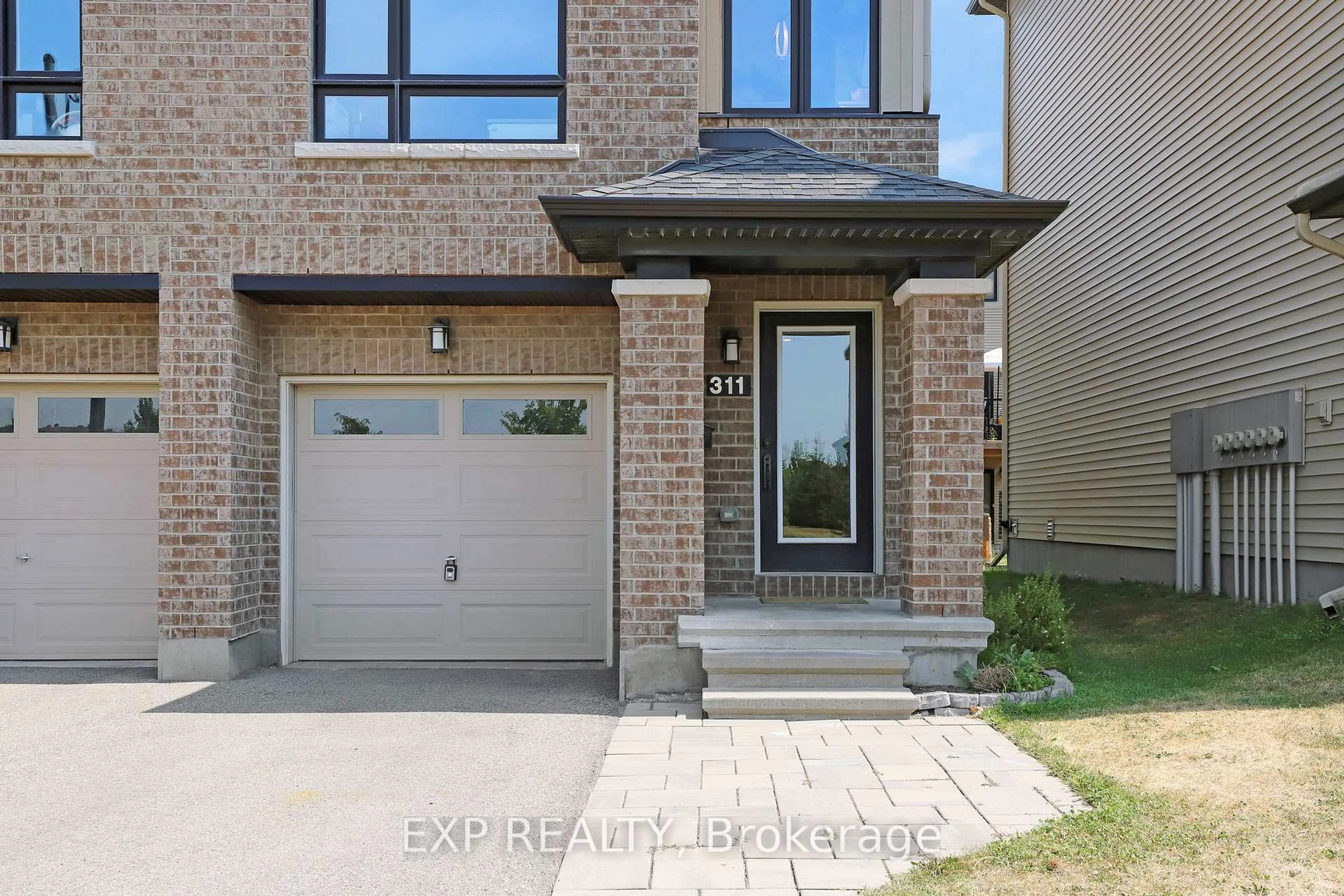 Home with brick exterior material, street for 311 Twinflower Way, Ottawa Ontario K2J 5B2