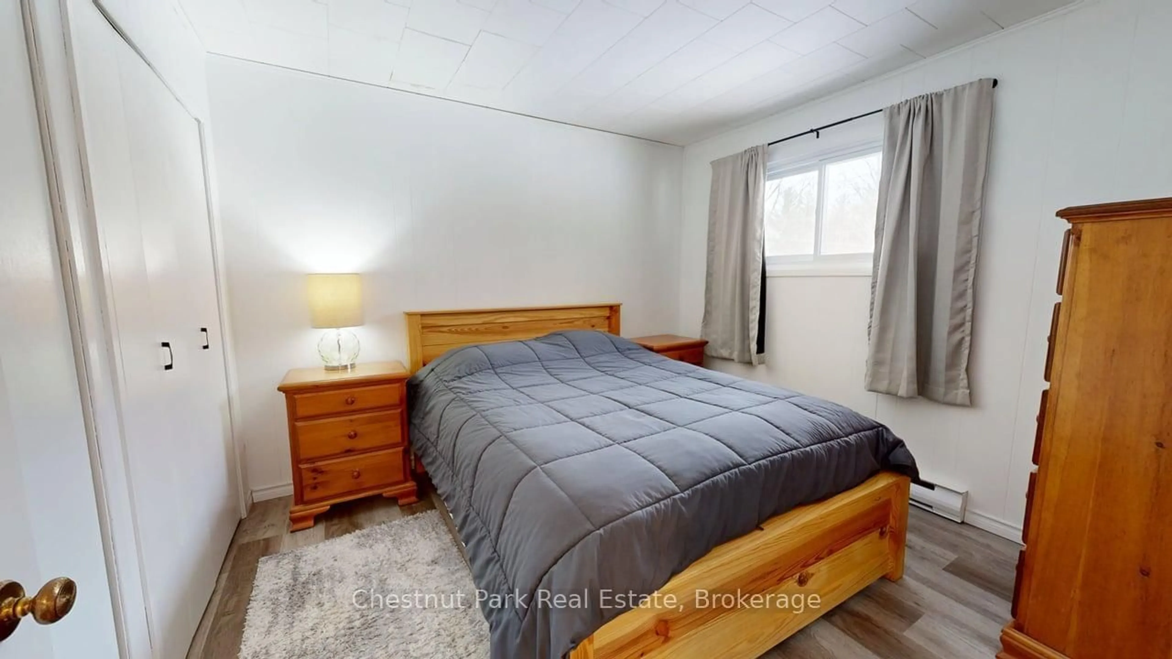 Bedroom with bed, wood/laminate floor for 381 HIGH St, Georgian Bay Ontario P0C 1H0