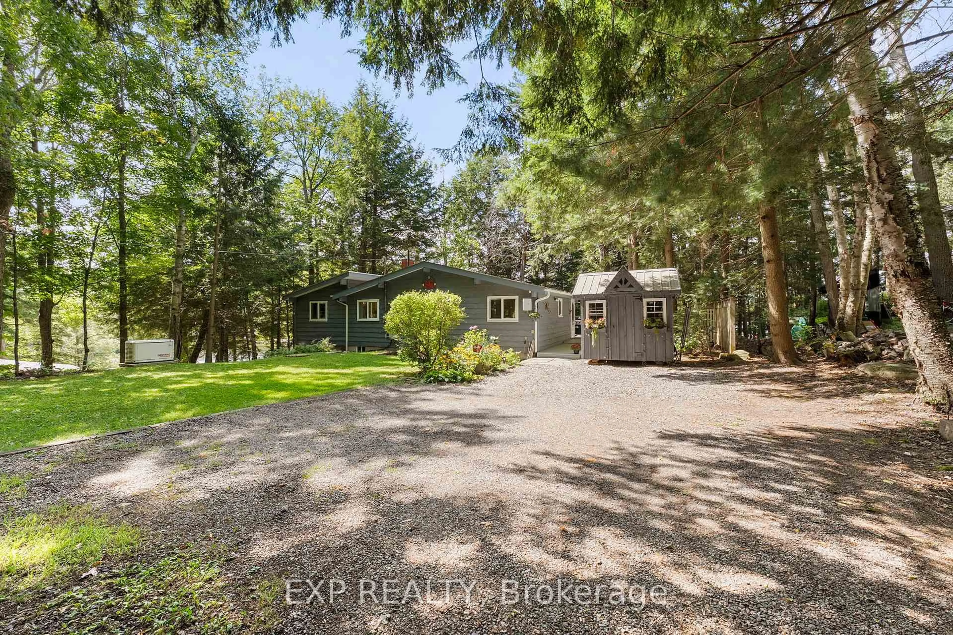 A pic from outside/outdoor area/front of a property/back of a property/a pic from drone, unknown for 1105 Butterfly Rd #1, Muskoka Lakes Ontario P0B 1J0