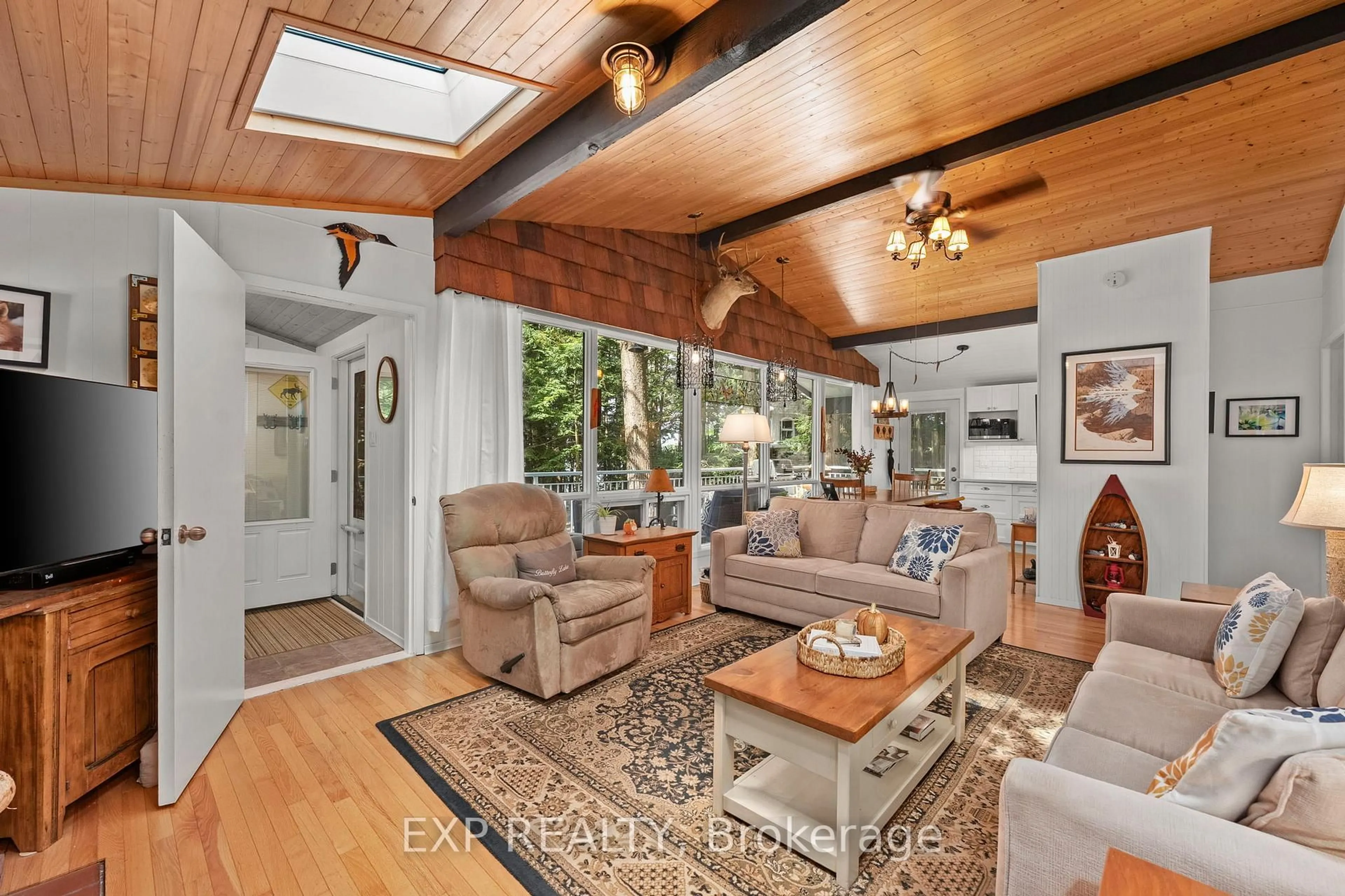 Living room with furniture, unknown for 1105 Butterfly Rd #1, Muskoka Lakes Ontario P0B 1J0