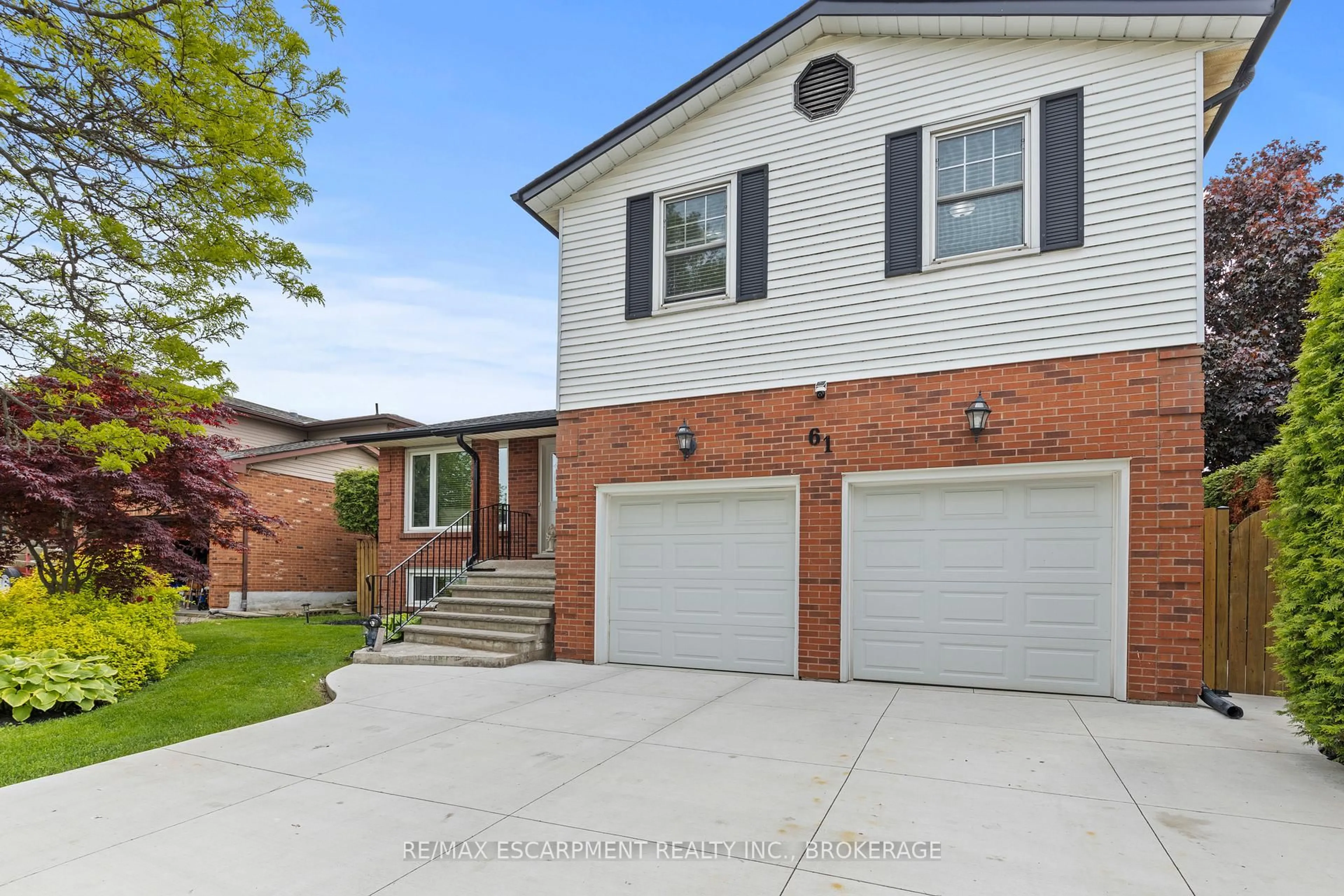 Home with brick exterior material, street for 61 Seaton Place Dr, Hamilton Ontario L8E 4A8