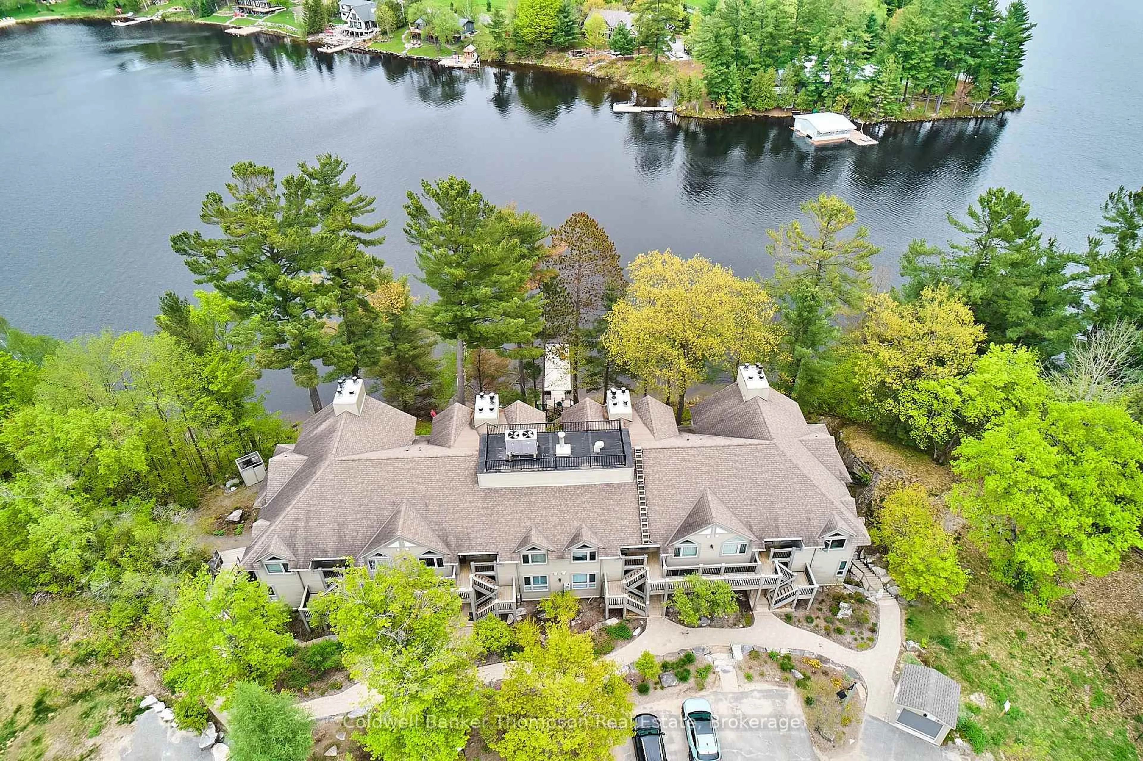 A pic from outside/outdoor area/front of a property/back of a property/a pic from drone, water/lake/river/ocean view for 5811 Grandview Signature Dr, Huntsville Ontario P1H 2N1
