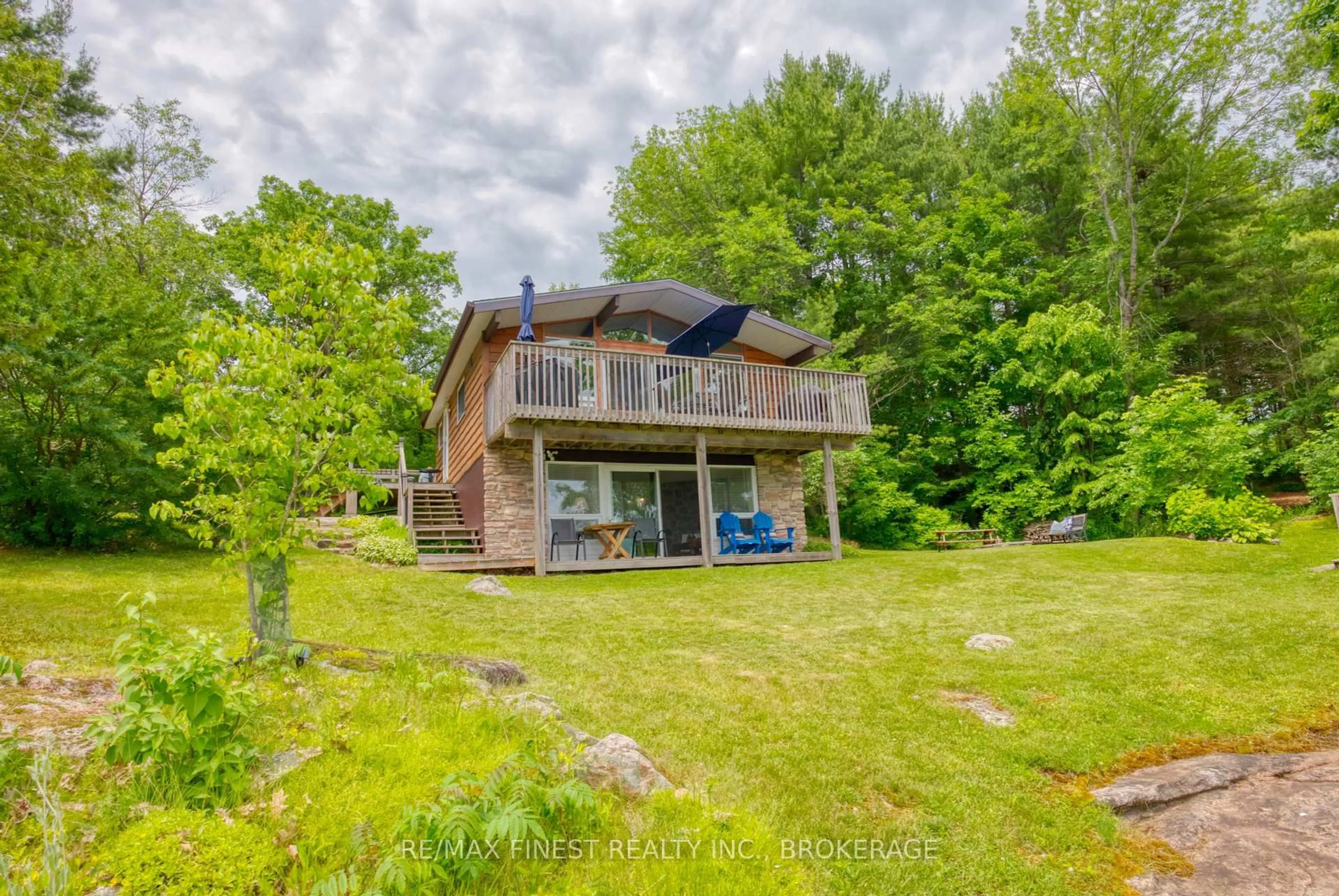A pic from outside/outdoor area/front of a property/back of a property/a pic from drone, water/lake/river/ocean view for 1026B West Shore Lane, Parham Ontario K0H 2K0