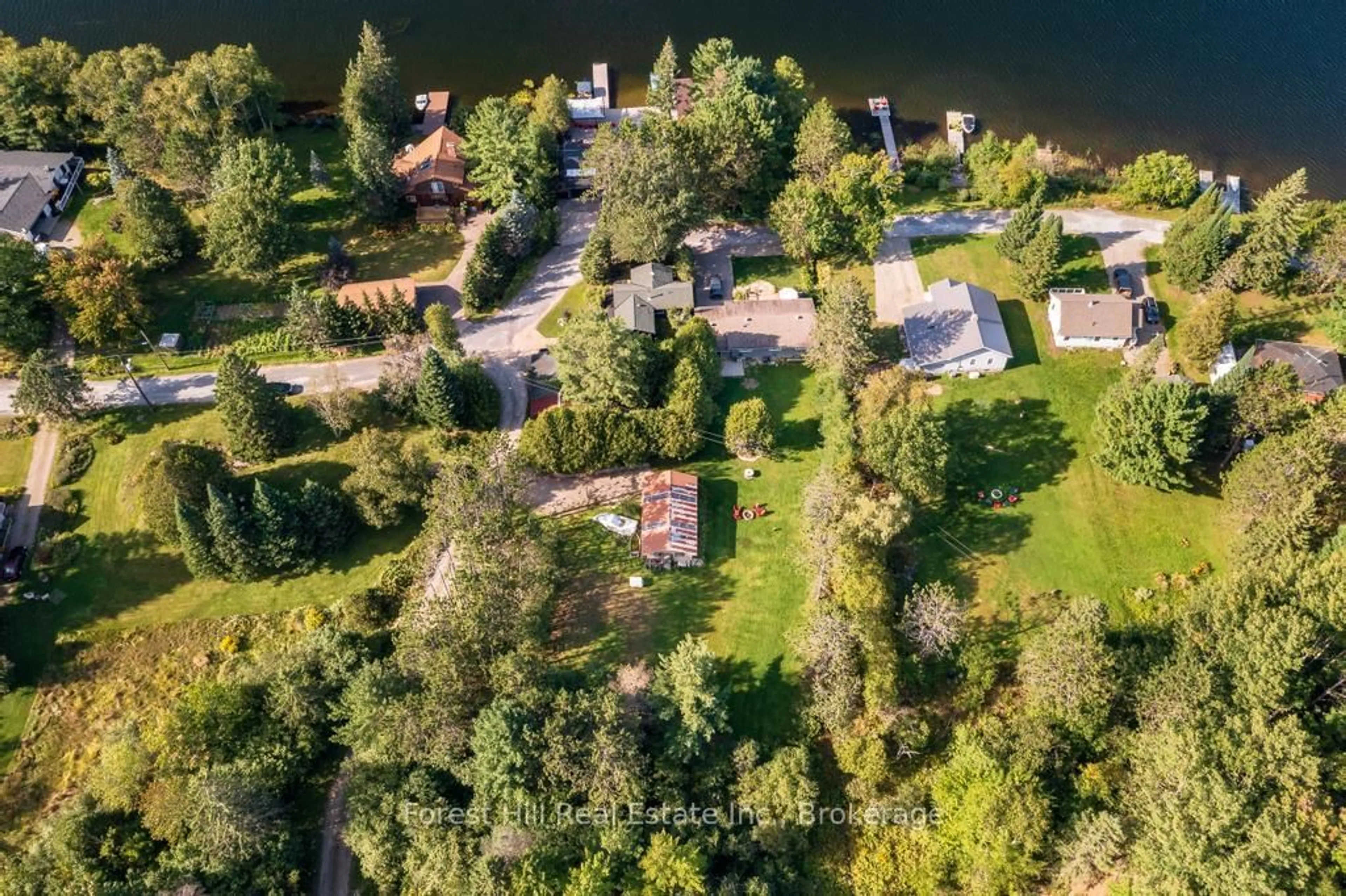 A pic from outside/outdoor area/front of a property/back of a property/a pic from drone, water/lake/river/ocean view for 1076 HARVEY Ave, Algonquin Highlands Ontario P0A 1E0