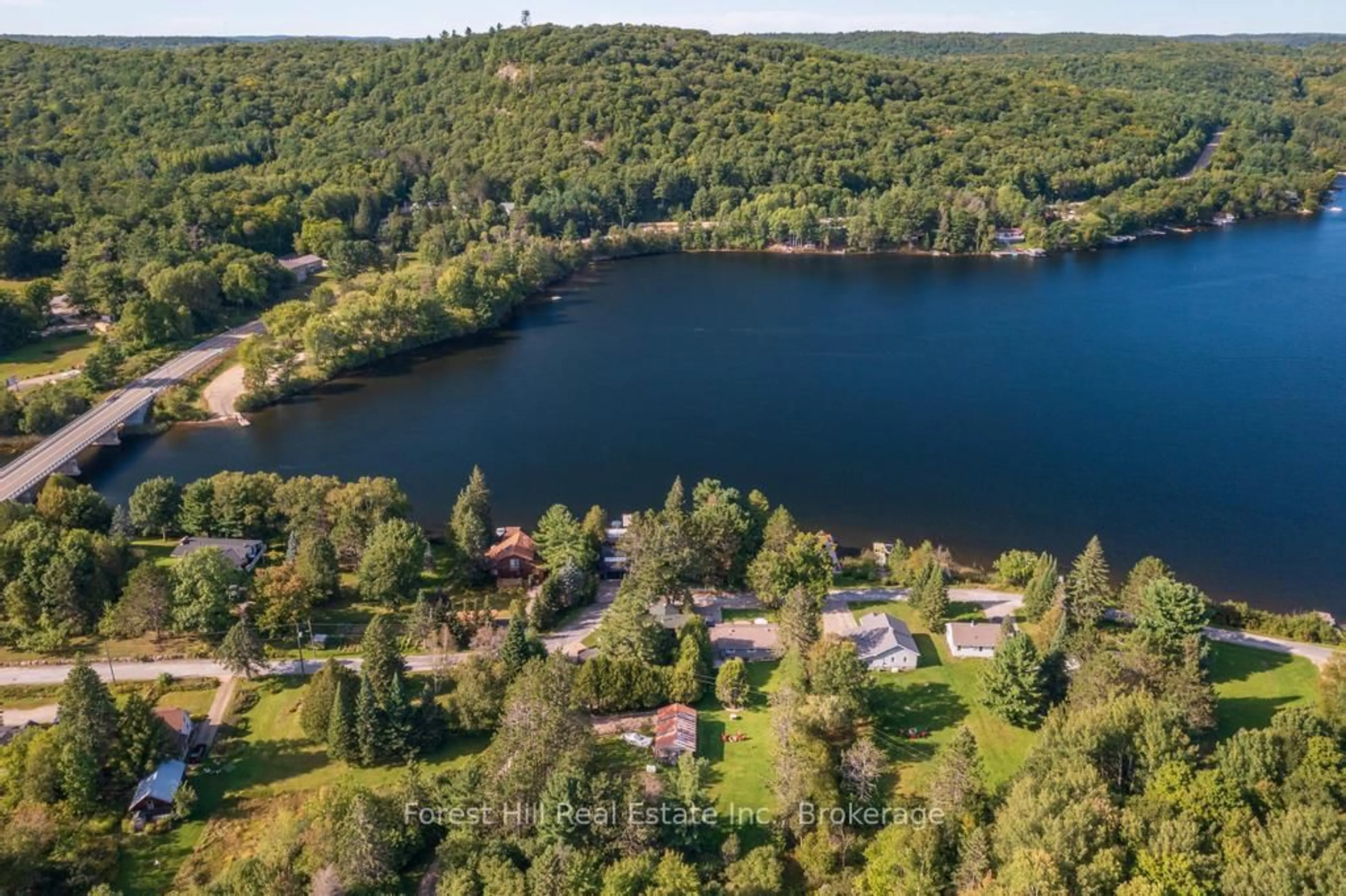 A pic from outside/outdoor area/front of a property/back of a property/a pic from drone, water/lake/river/ocean view for 1076 HARVEY Ave, Algonquin Highlands Ontario P0A 1E0