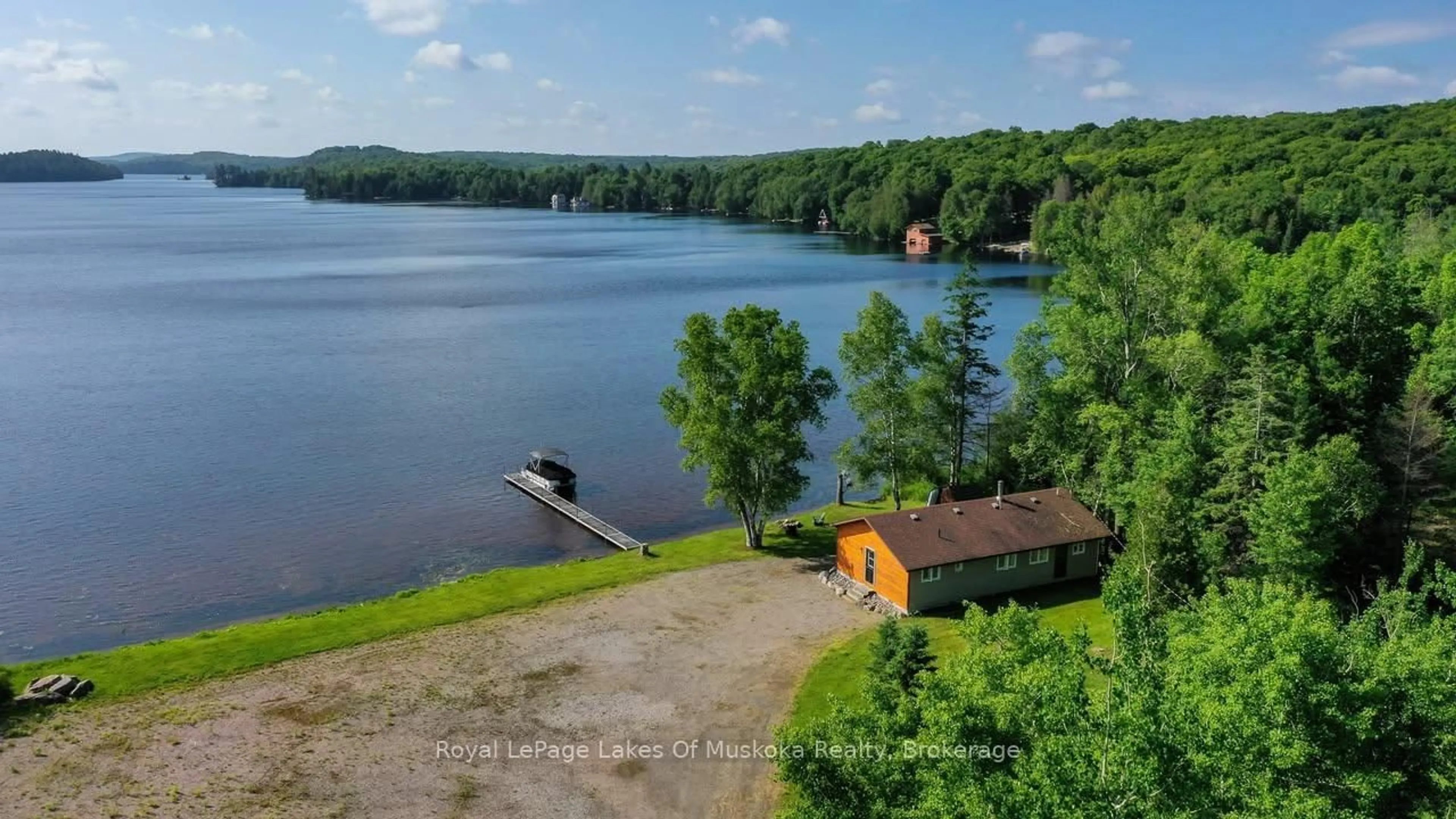 A pic from outside/outdoor area/front of a property/back of a property/a pic from drone, water/lake/river/ocean view for 3105 520 Highway, Magnetawan Ontario P0A 1P0
