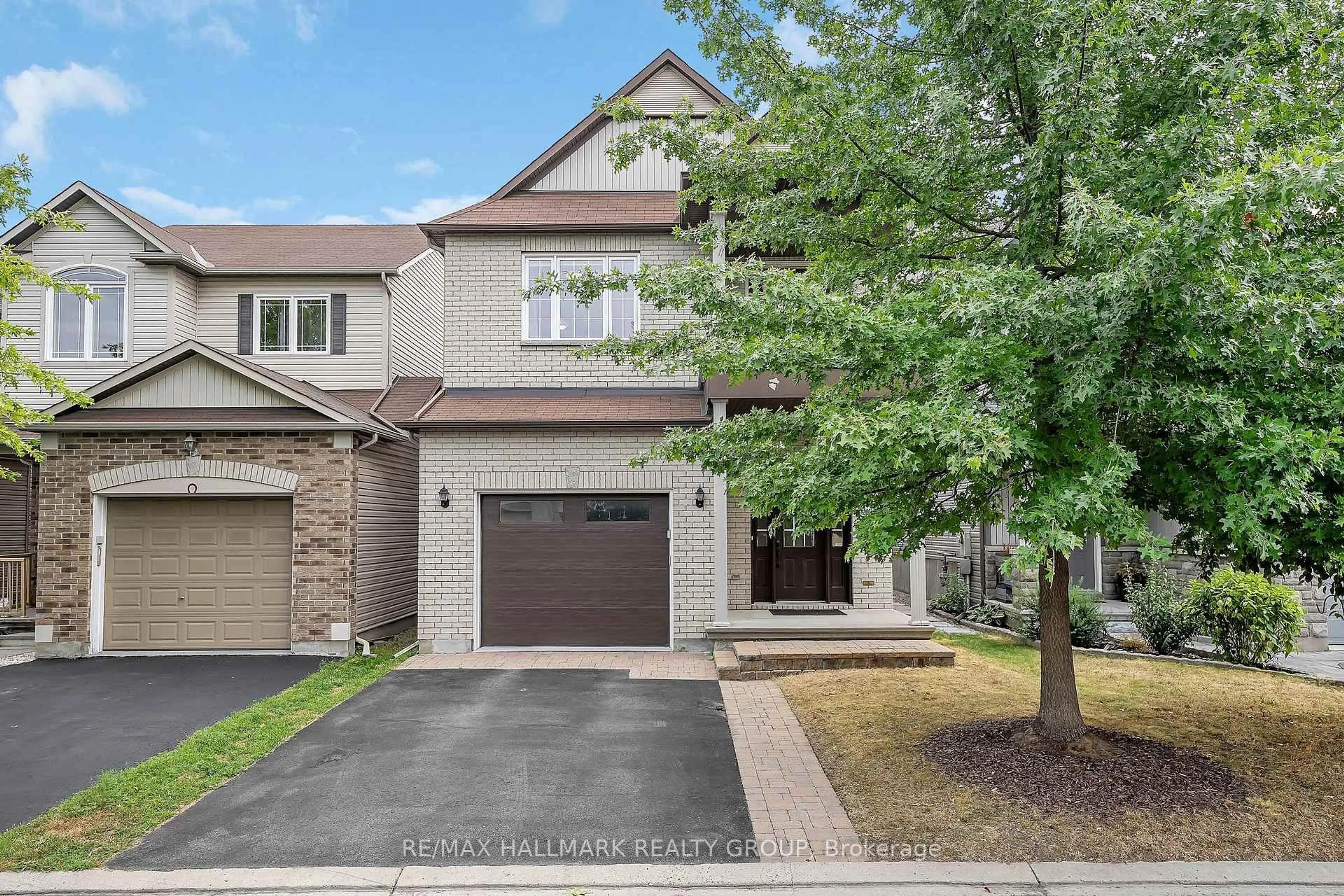 Home with brick exterior material, street for 218 Harthill Way, Ottawa Ontario K2J 0P2