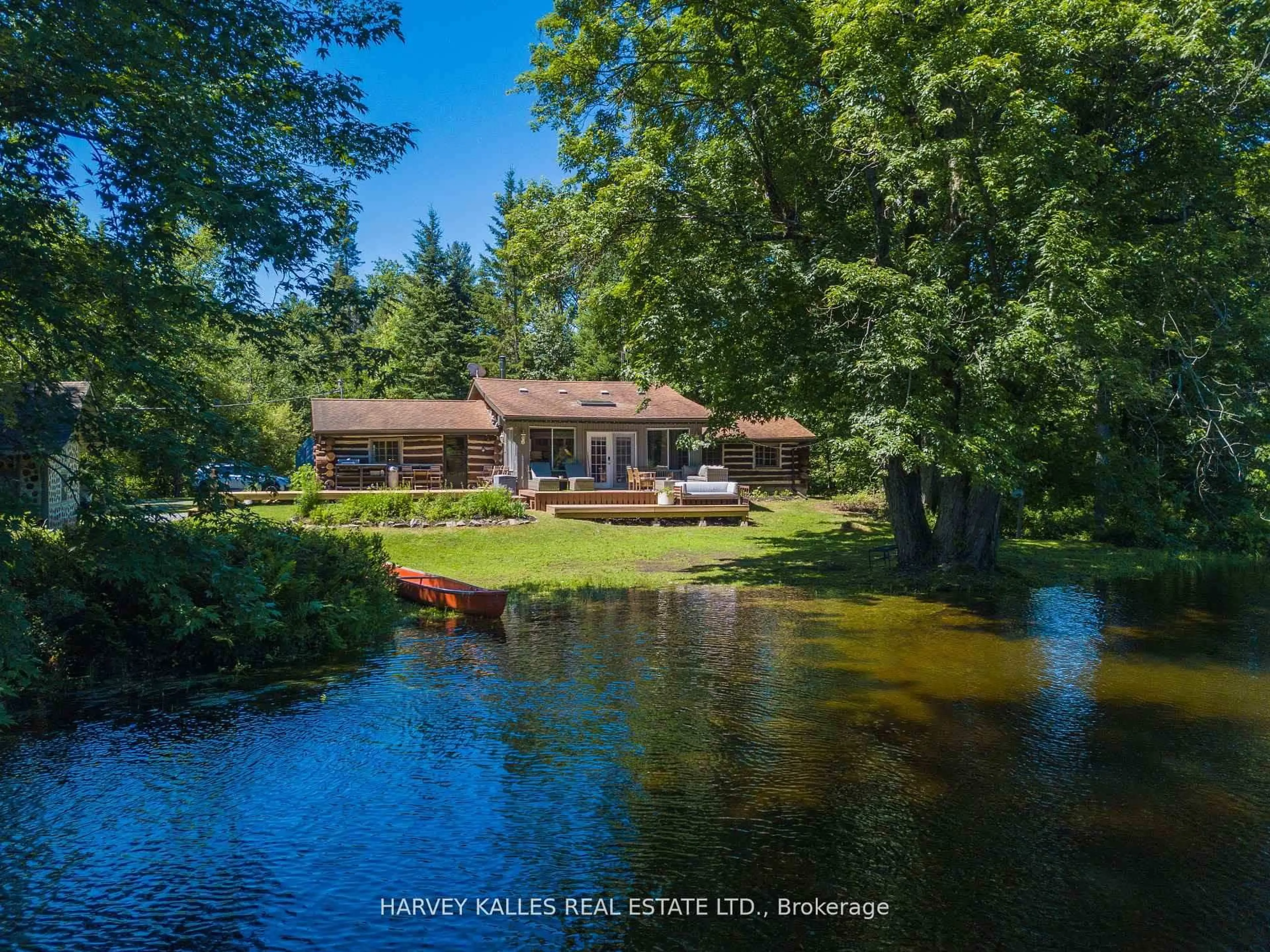 A pic from outside/outdoor area/front of a property/back of a property/a pic from drone, water/lake/river/ocean view for 1053 Sherwood Forest Rd, Bracebridge Ontario P1L 1X3
