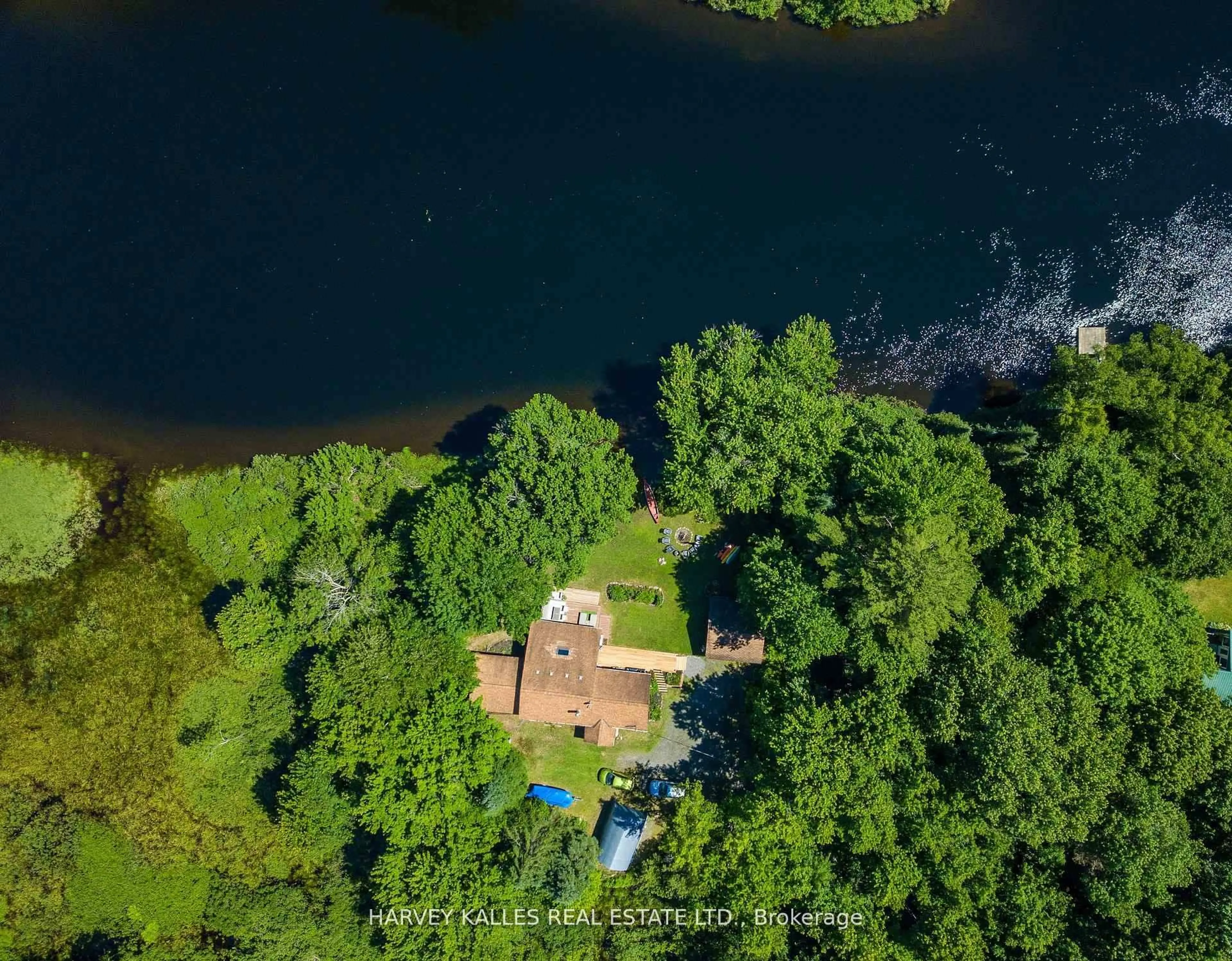 A pic from outside/outdoor area/front of a property/back of a property/a pic from drone, water/lake/river/ocean view for 1053 Sherwood Forest Rd, Bracebridge Ontario P1L 1X3
