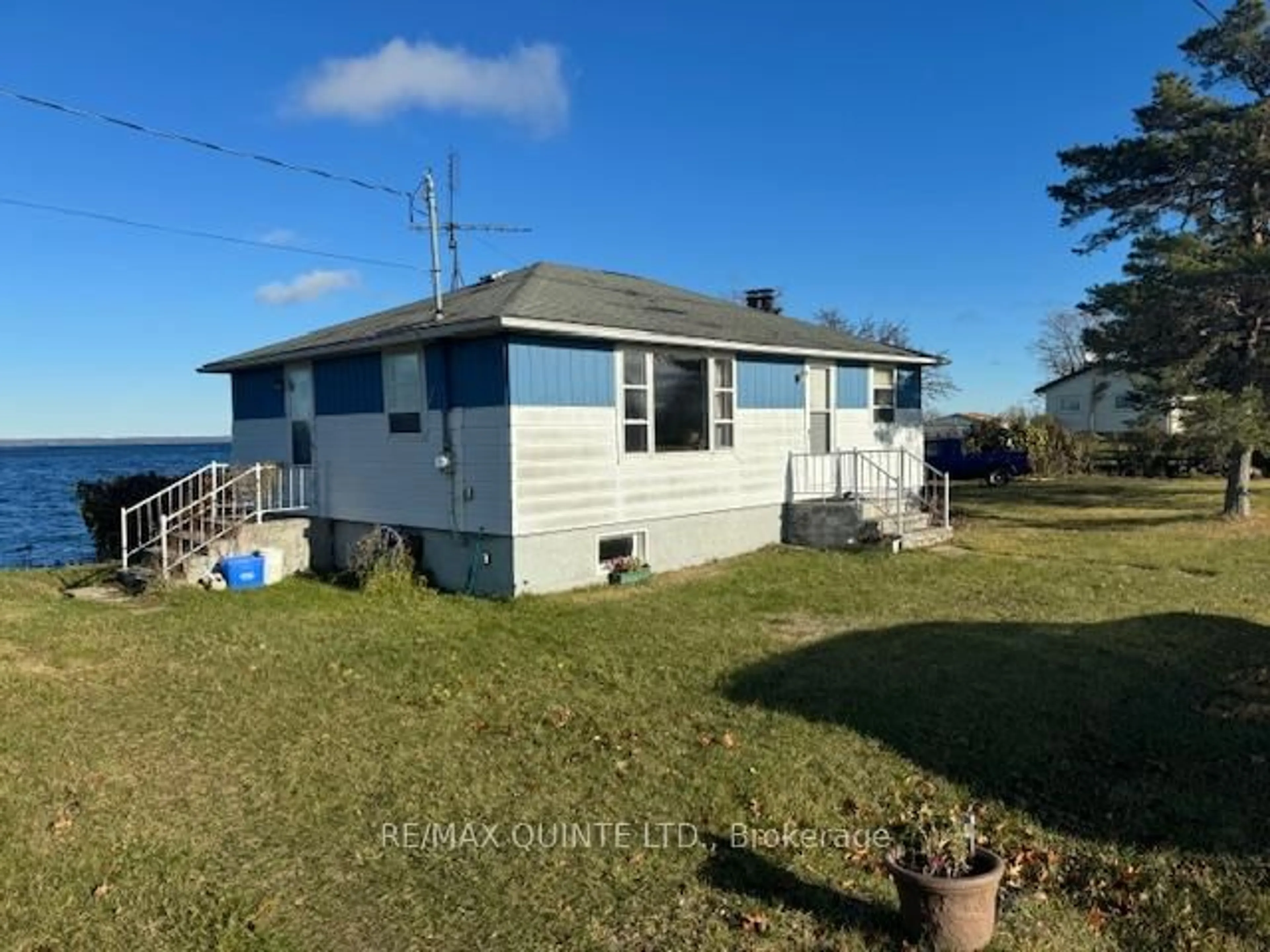 A pic from outside/outdoor area/front of a property/back of a property/a pic from drone, water/lake/river/ocean view for 5083 Long Point Rd, Prince Edward County Ontario K0K 2T0