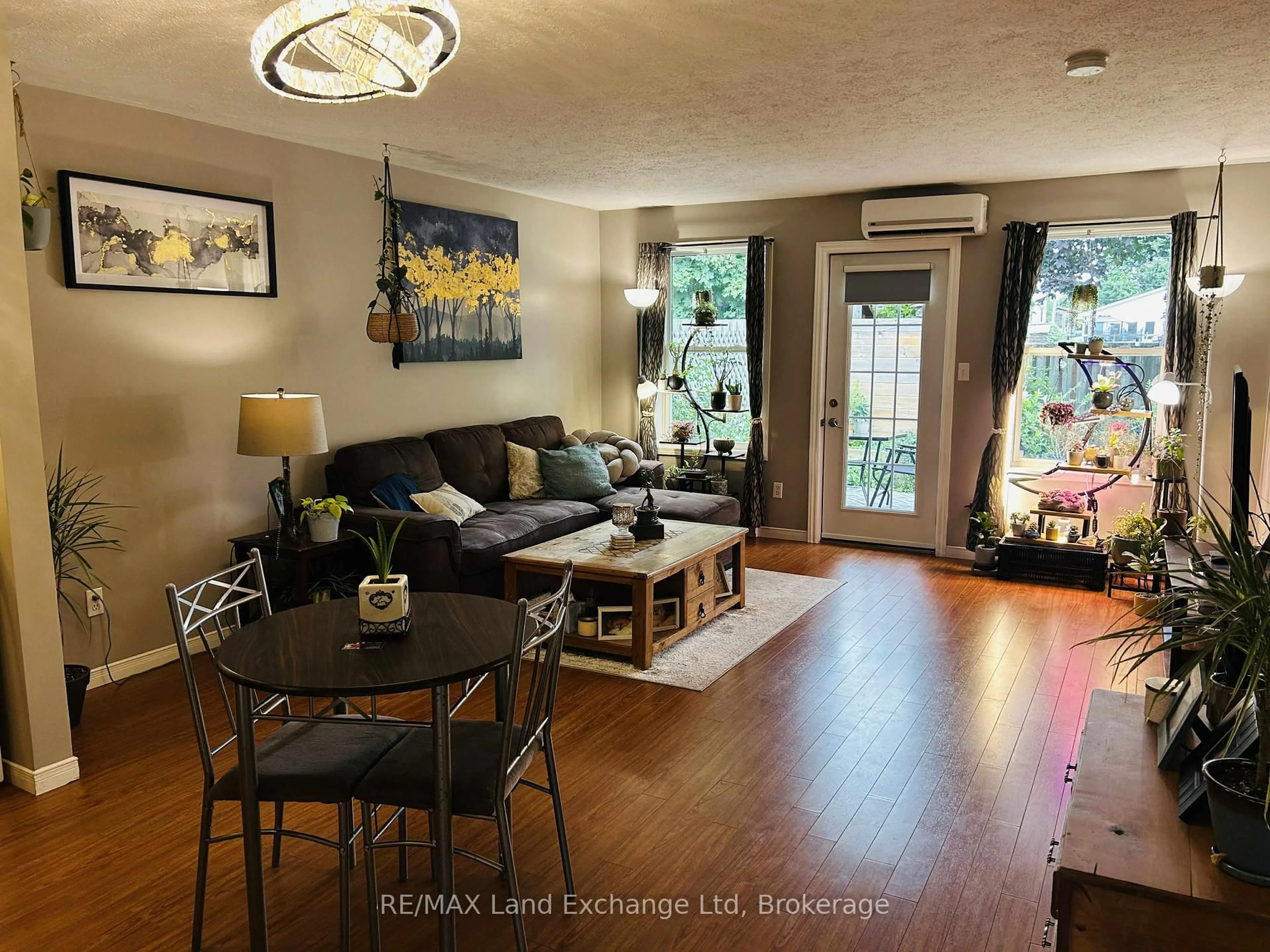 Living room with furniture, wood/laminate floor for 1028 Ann St #10, Howick Ontario N0G 2X0