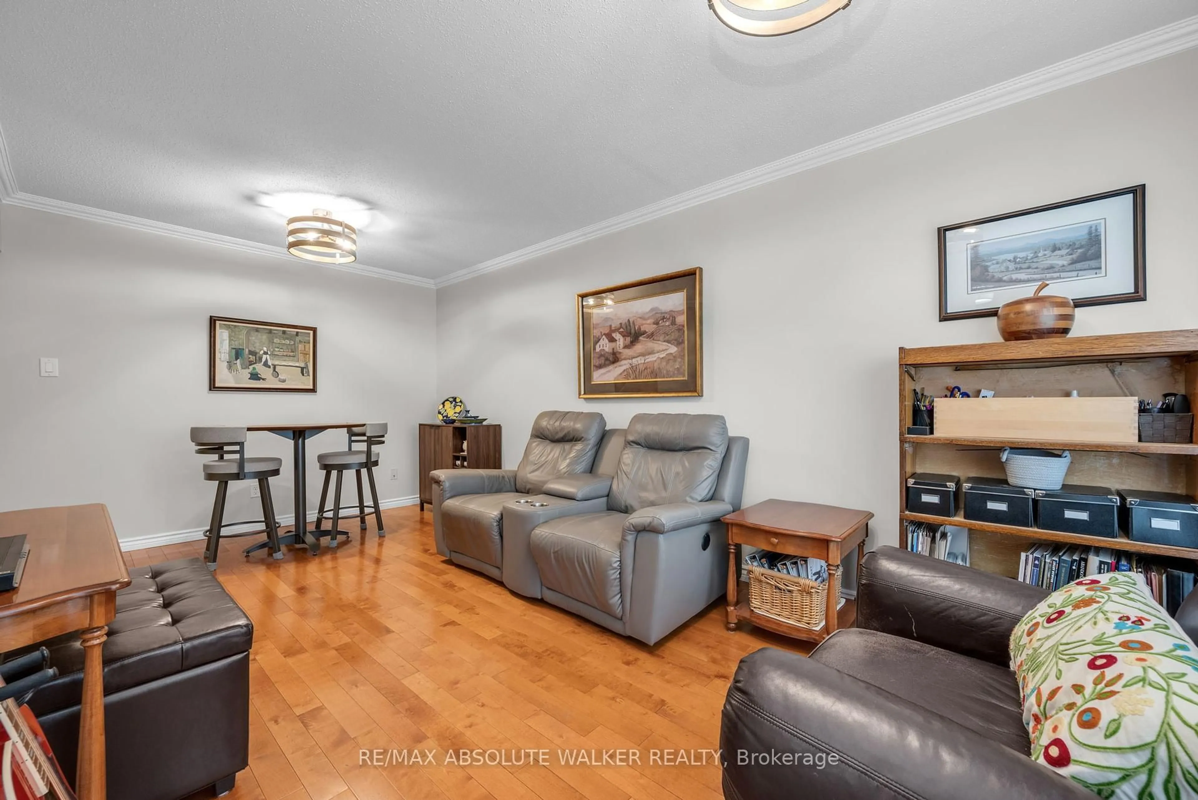 Living room with furniture, wood/laminate floor for 757 Clearcrest Cres, Ottawa Ontario K4A 3E7