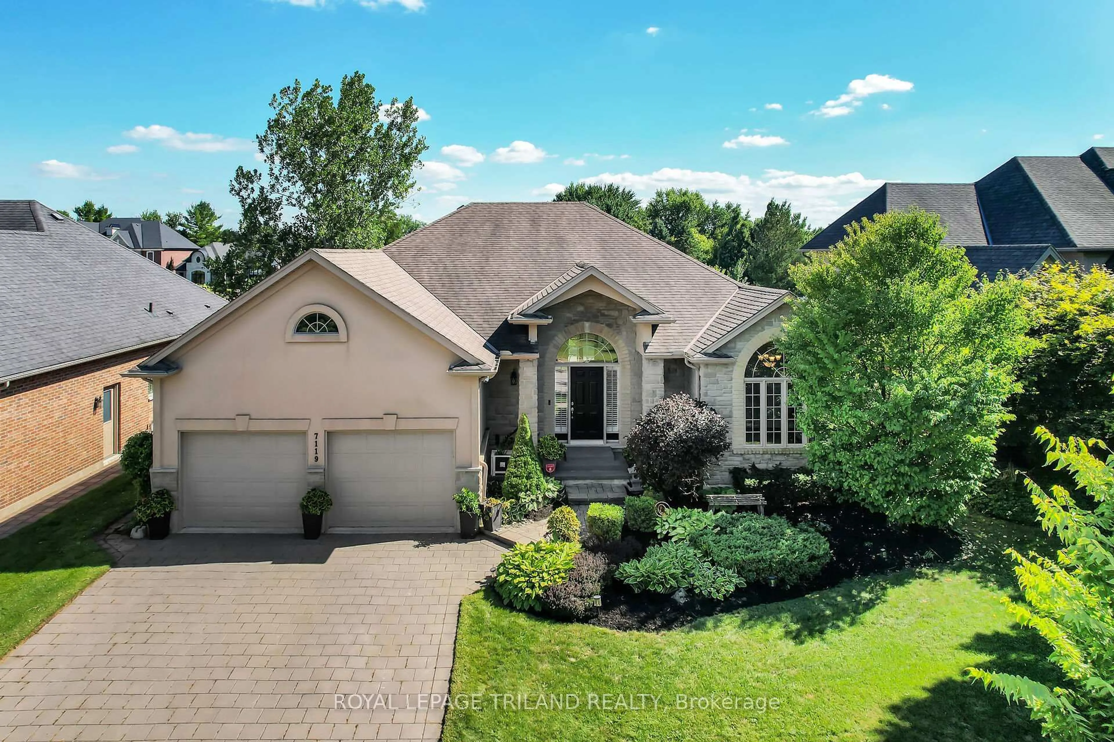 A pic from outside/outdoor area/front of a property/back of a property/a pic from drone, street for 7119 Clayton Walk, London South Ontario N6P 1V3