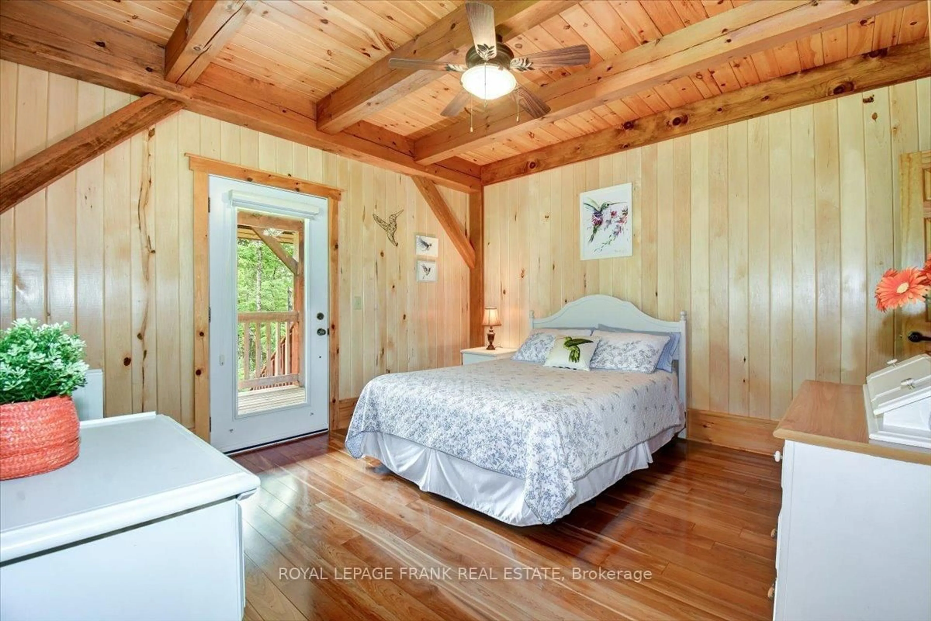 Bedroom with bed, wood/laminate floor for 944 Steenburg Lake Rd, Hastings Ontario K0L 1W0