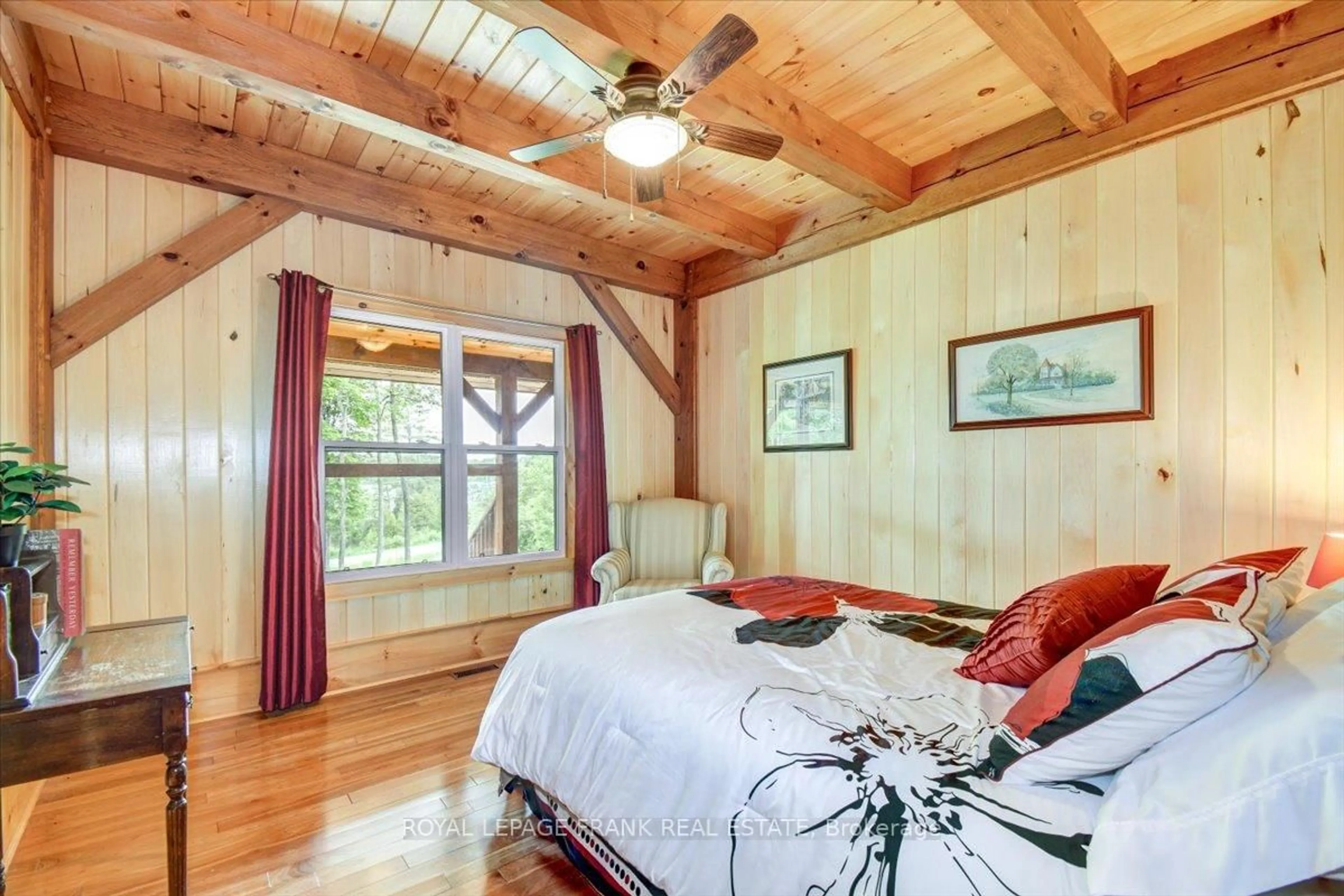 Bedroom with bed, wood/laminate floor for 944 Steenburg Lake Rd, Hastings Ontario K0L 1W0