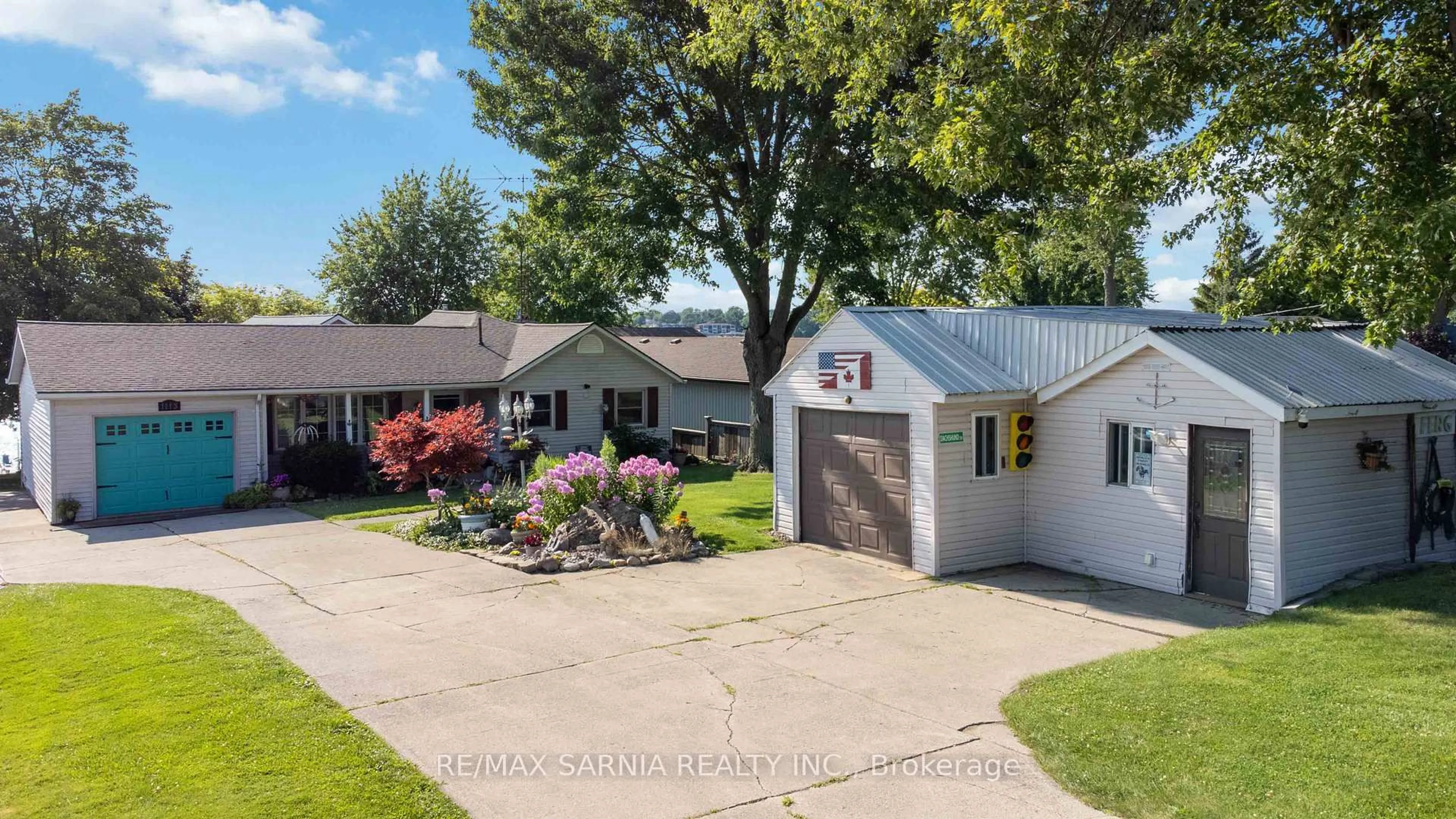 A pic from outside/outdoor area/front of a property/back of a property/a pic from drone, street for 1113 St Clair Pkwy, St. Clair Ontario N0N 1M0