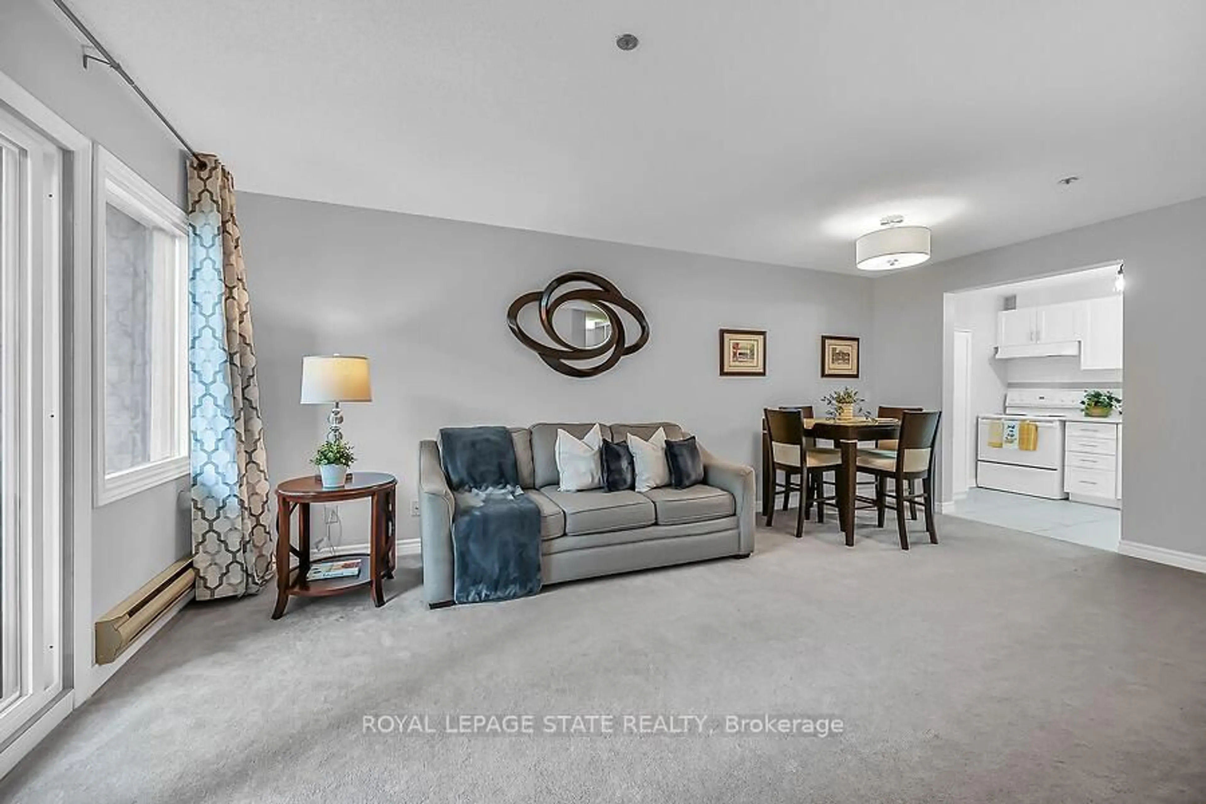 Living room with furniture, carpet floor for 6 Niagara St #204, Grimsby Ontario L3M 5A4