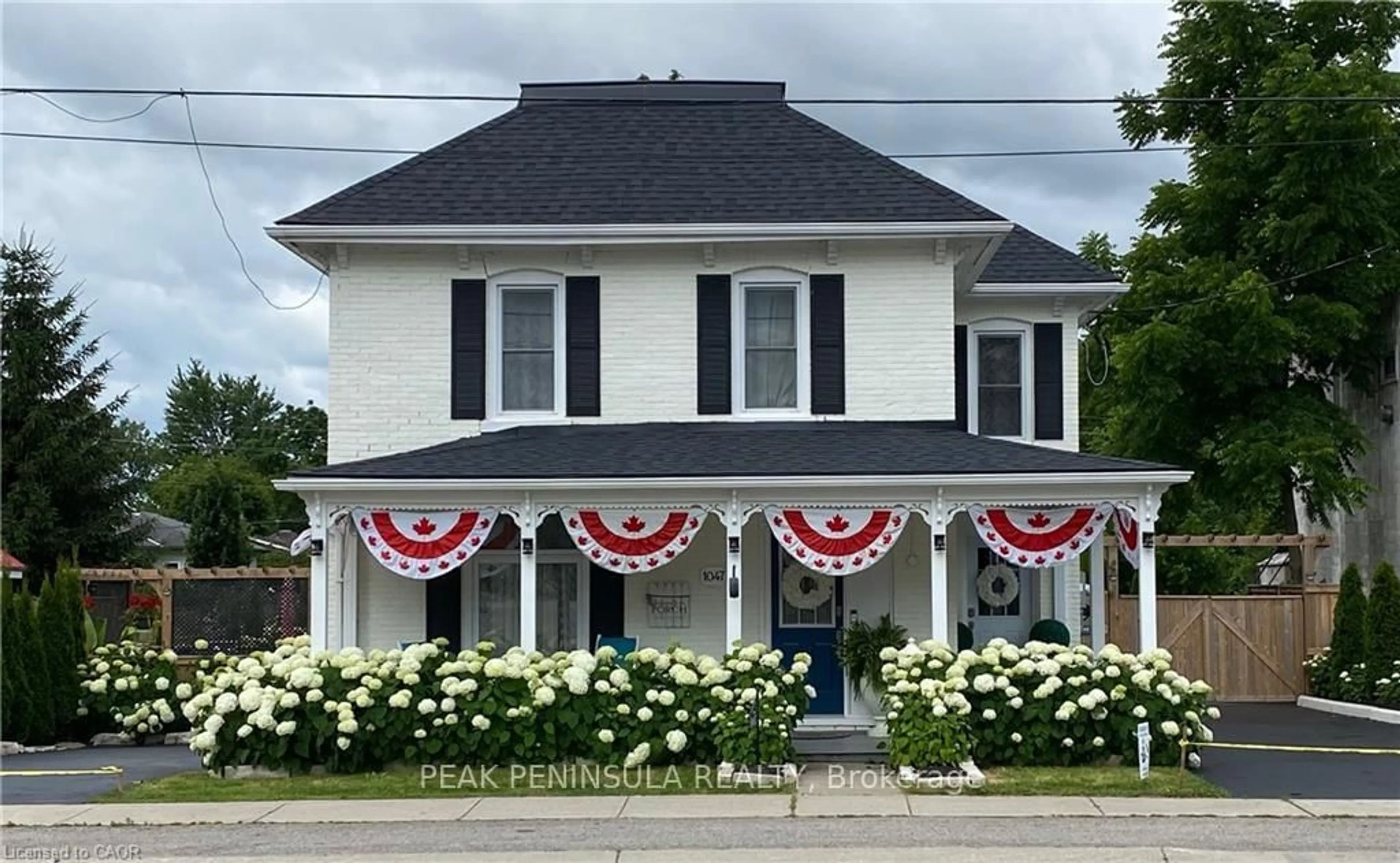Home with vinyl exterior material, street for 1047 Bay St, Norfolk Ontario N0E 1M0
