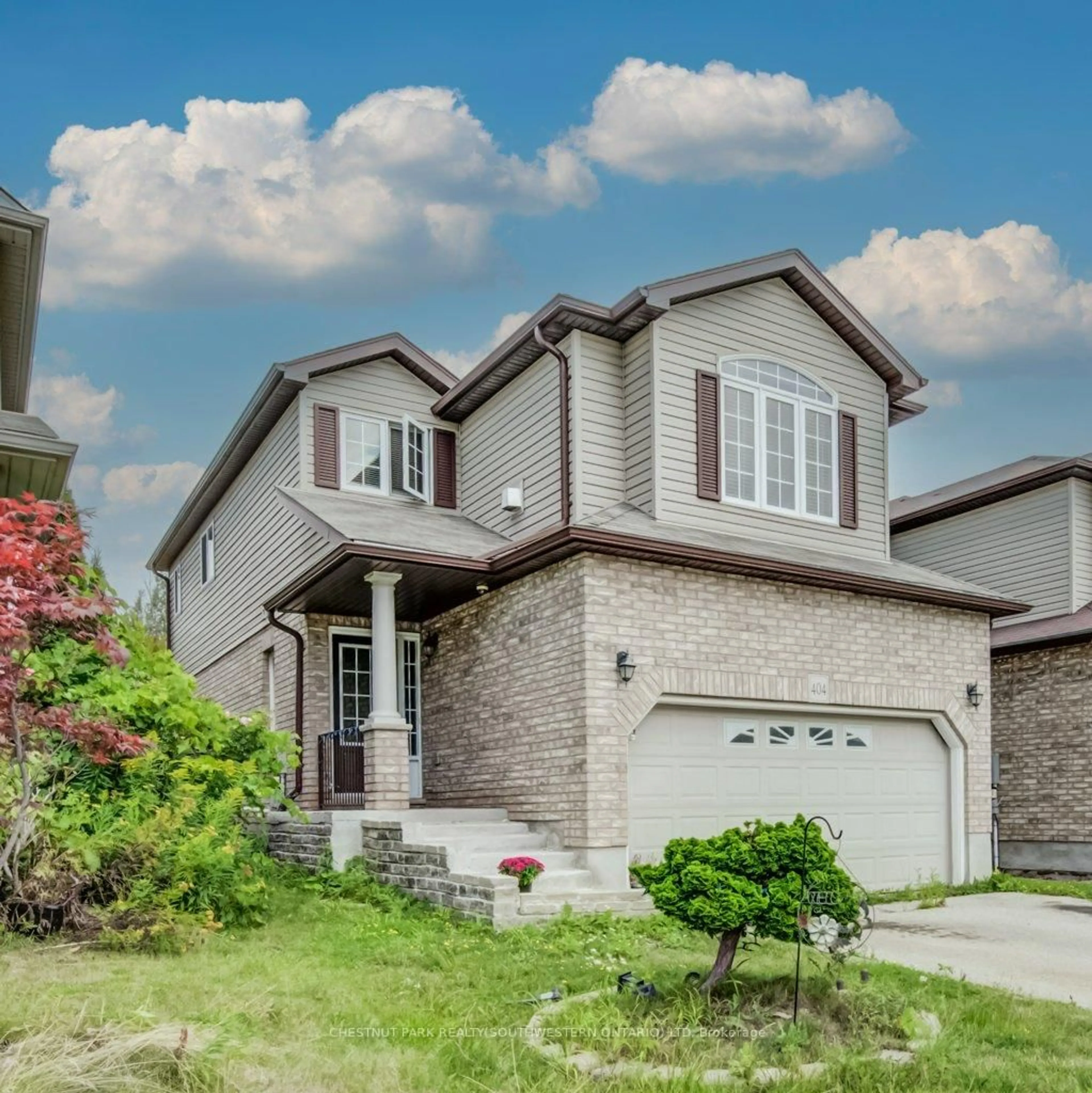 Home with brick exterior material, street for 404 Tealby Cres, Waterloo Ontario N2J 4Y8