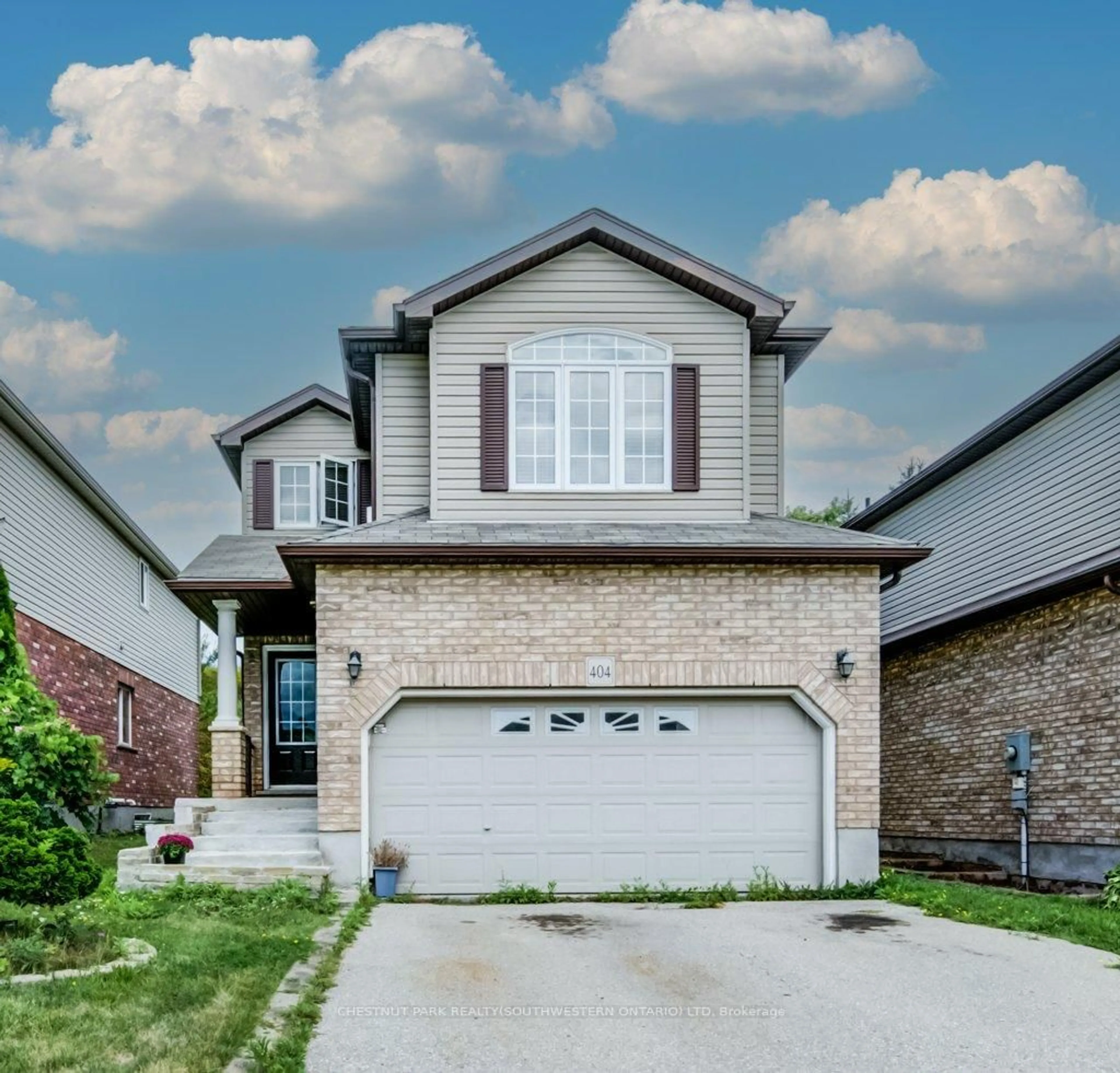 Home with brick exterior material, street for 404 Tealby Cres, Waterloo Ontario N2J 4Y8