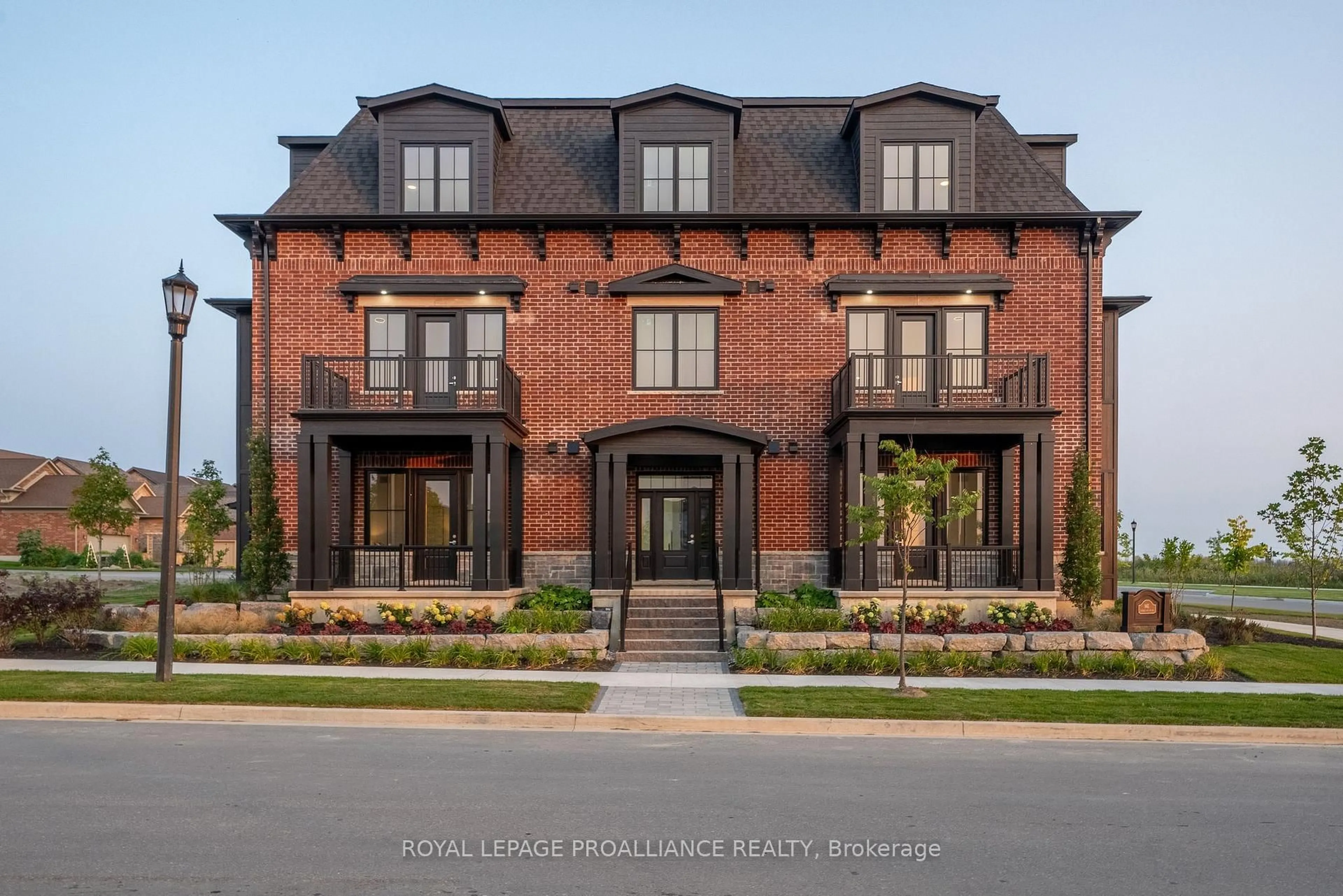 Home with brick exterior material, unknown for 941 Charles Wilson Pkwy #202, Cobourg Ontario K9A 0L2