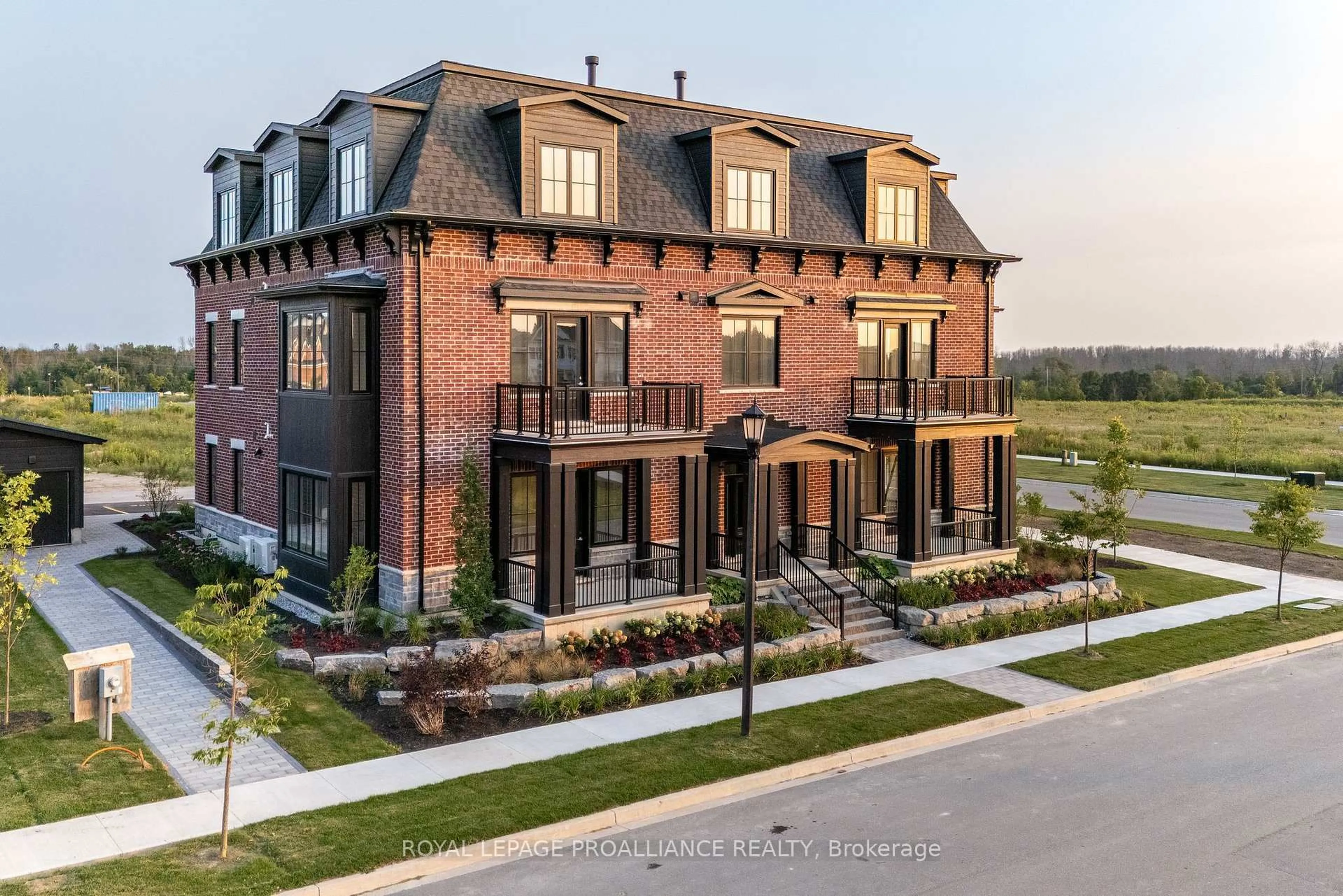 Home with brick exterior material, unknown for 941 Charles Wilson Pkwy #302, Cobourg Ontario K9A 0L2