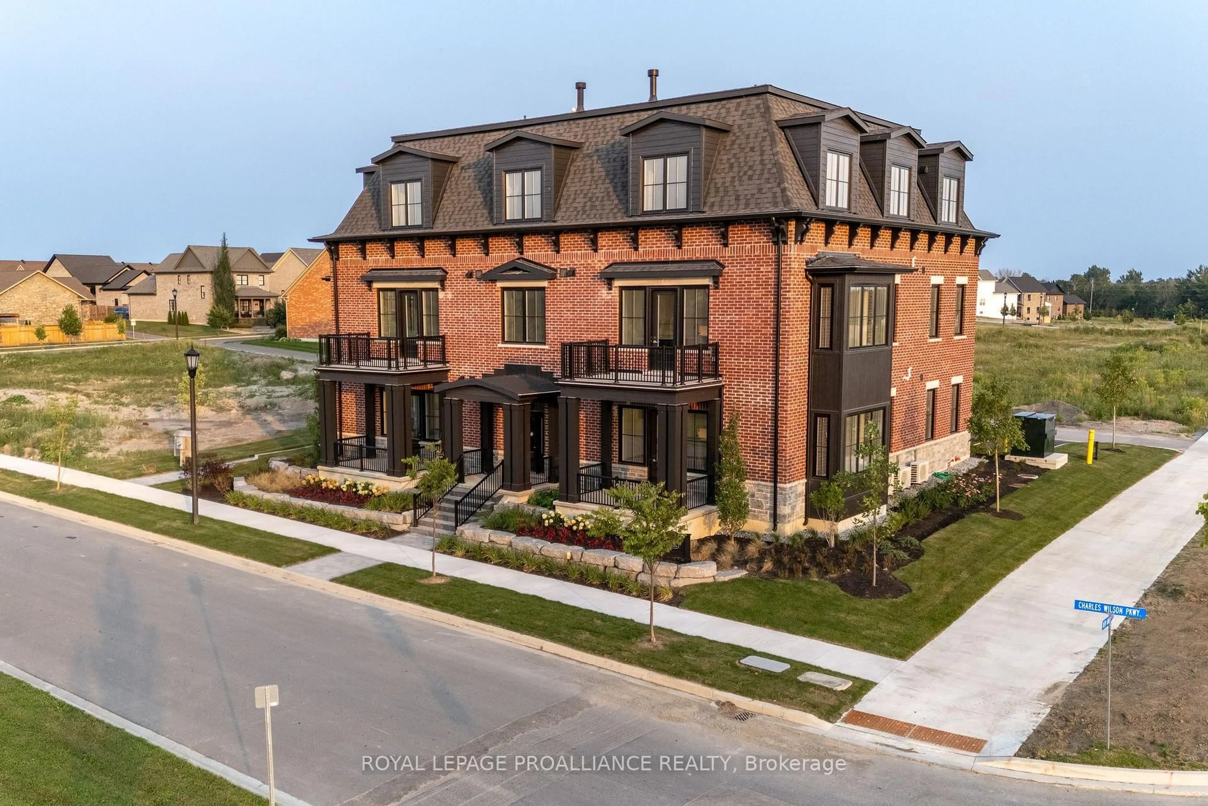 Home with brick exterior material, unknown for 941 Charles Wilson Pkwy #201, Cobourg Ontario K9A 0L2