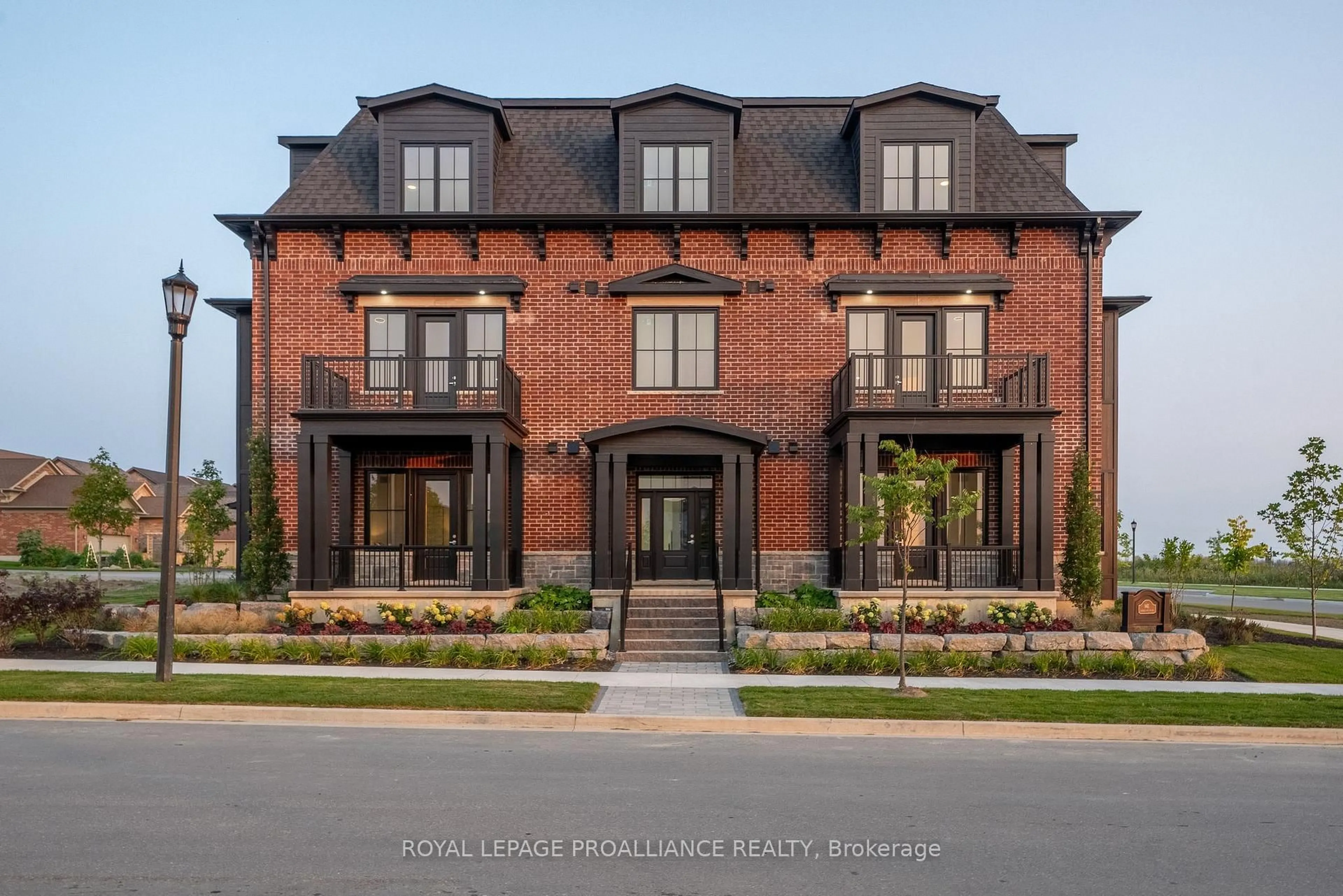 Home with brick exterior material, street for 941 Charles Wilson Pkwy #301, Cobourg Ontario K9A 0L2