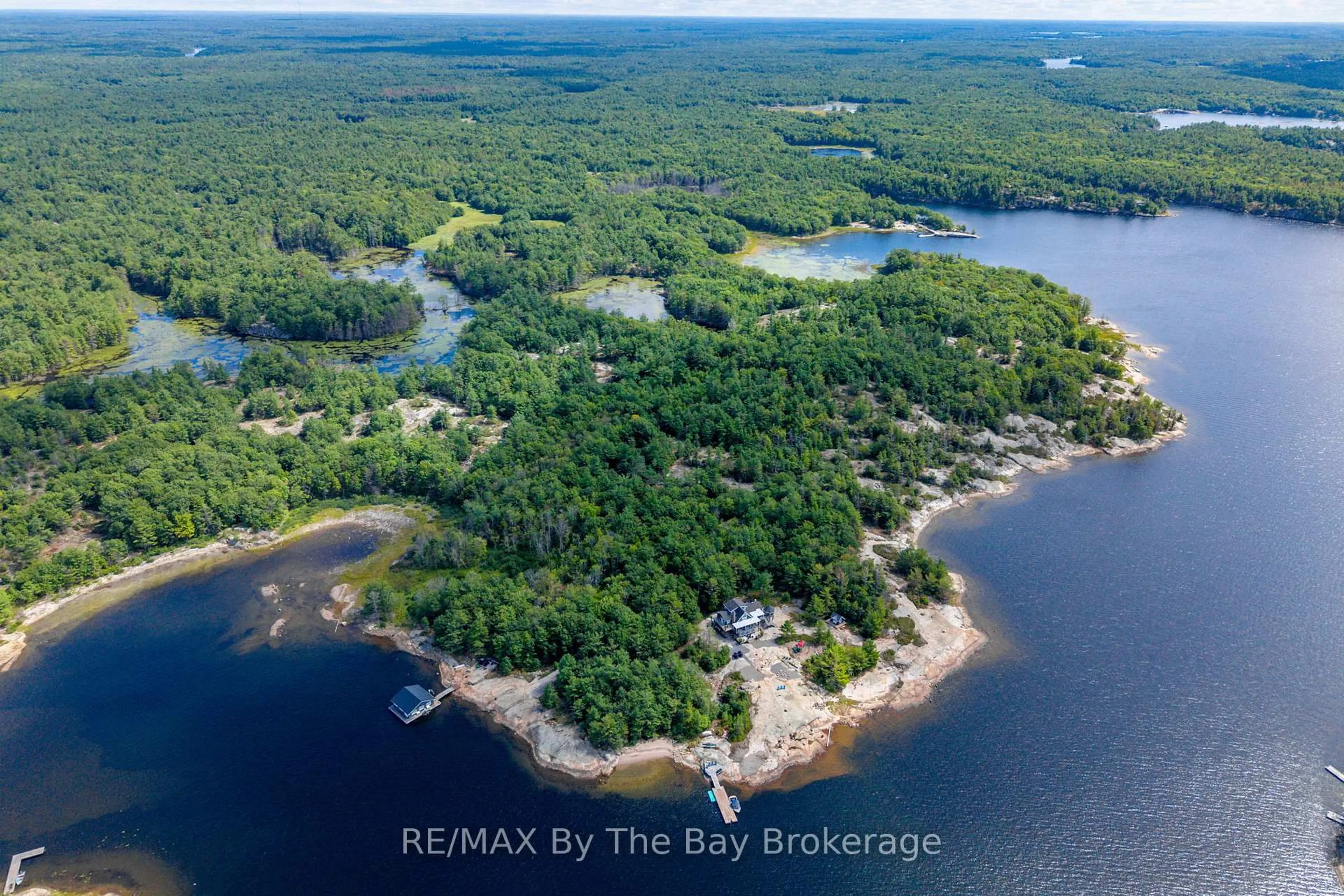 A pic from outside/outdoor area/front of a property/back of a property/a pic from drone, water/lake/river/ocean view for 19980 Georgian Bay Shore, Georgian Bay Ontario P0E 1E0
