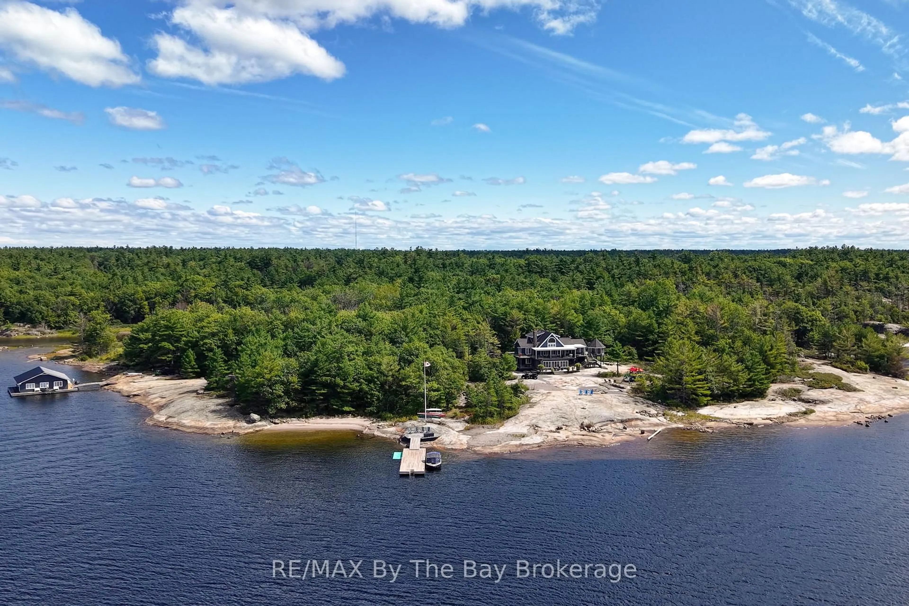 A pic from outside/outdoor area/front of a property/back of a property/a pic from drone, water/lake/river/ocean view for 19980 Georgian Bay Shore, Georgian Bay Ontario P0E 1E0