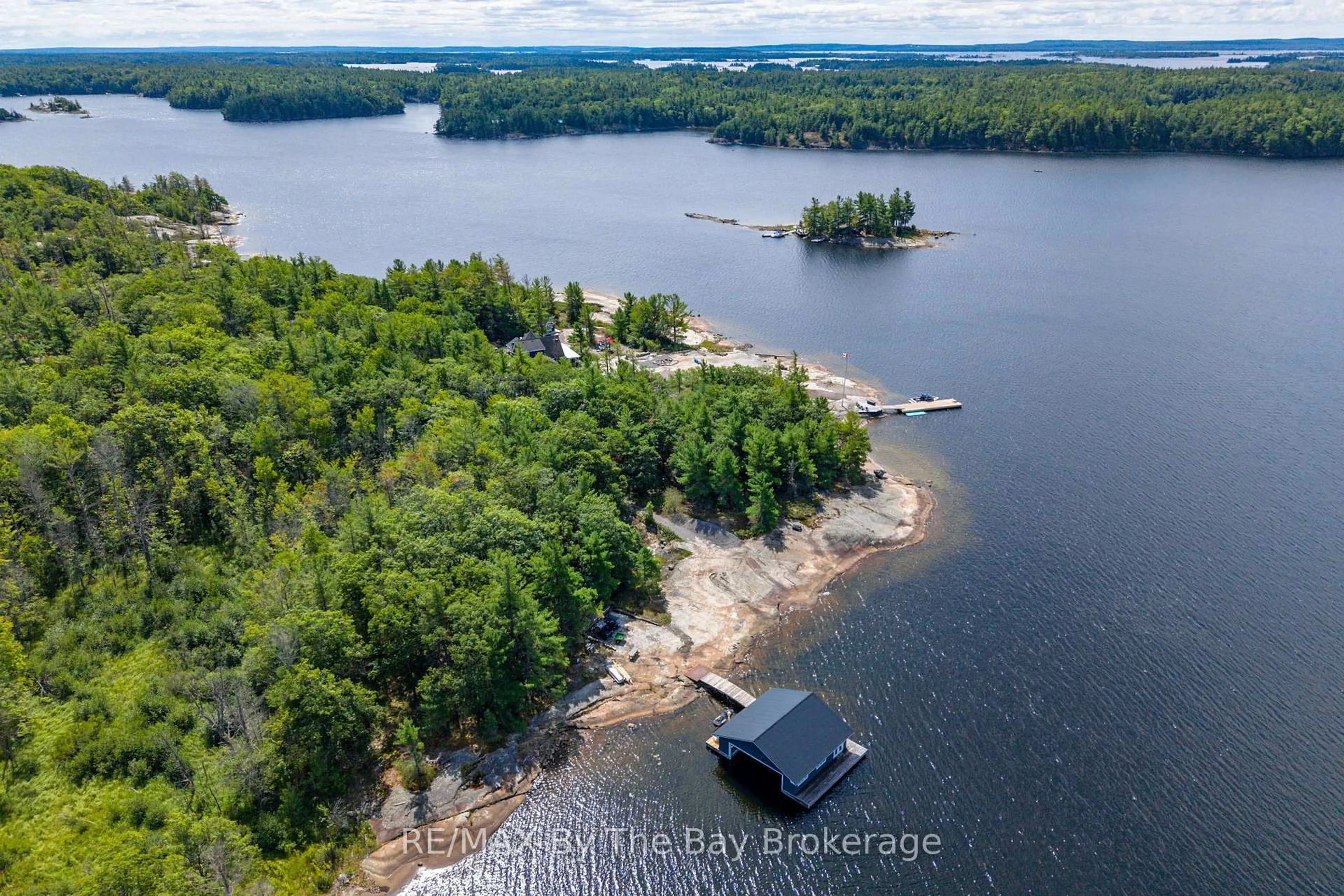 A pic from outside/outdoor area/front of a property/back of a property/a pic from drone, water/lake/river/ocean view for 19980 Georgian Bay Shore, Georgian Bay Ontario P0E 1E0