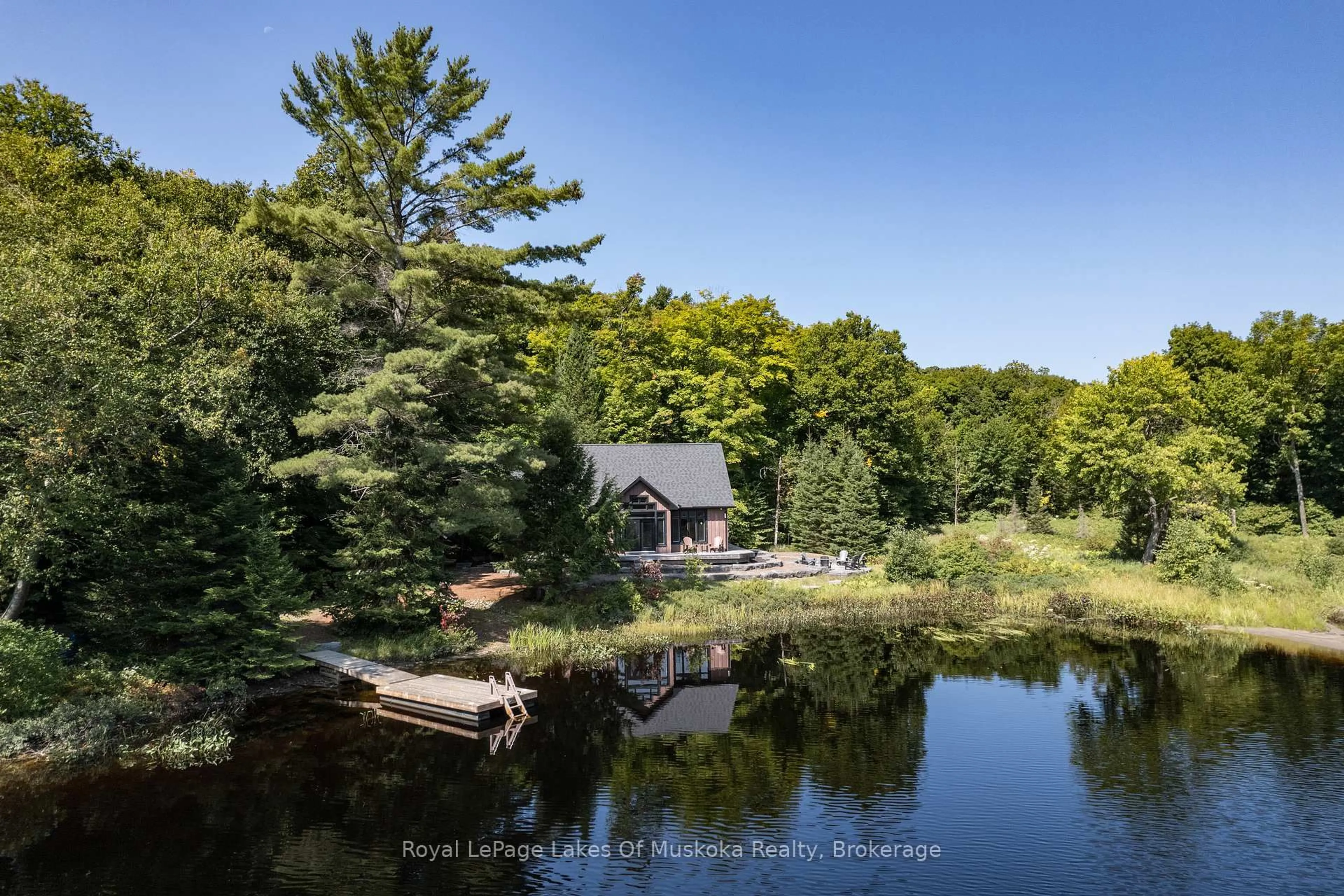 A pic from outside/outdoor area/front of a property/back of a property/a pic from drone, water/lake/river/ocean view for 195 CHARLIES Lane, Huntsville Ontario P0B 1M0