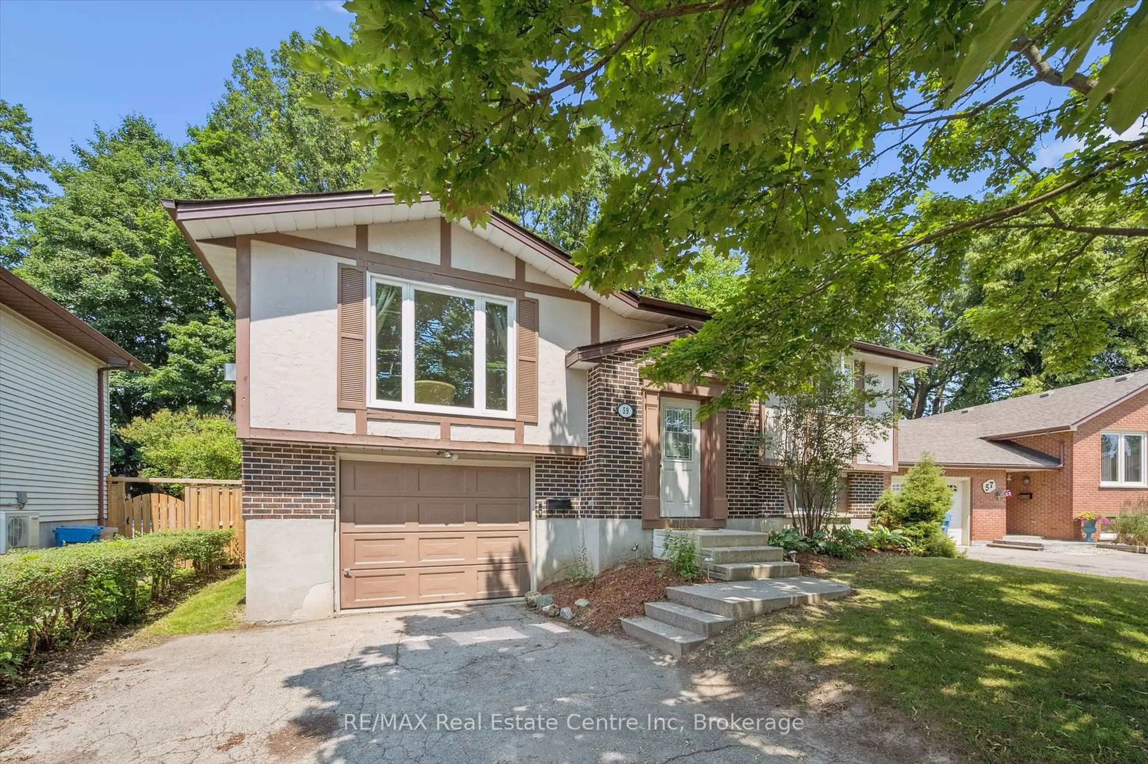 Home with brick exterior material, street for 59 Steffler Dr, Guelph Ontario N1G 3L5