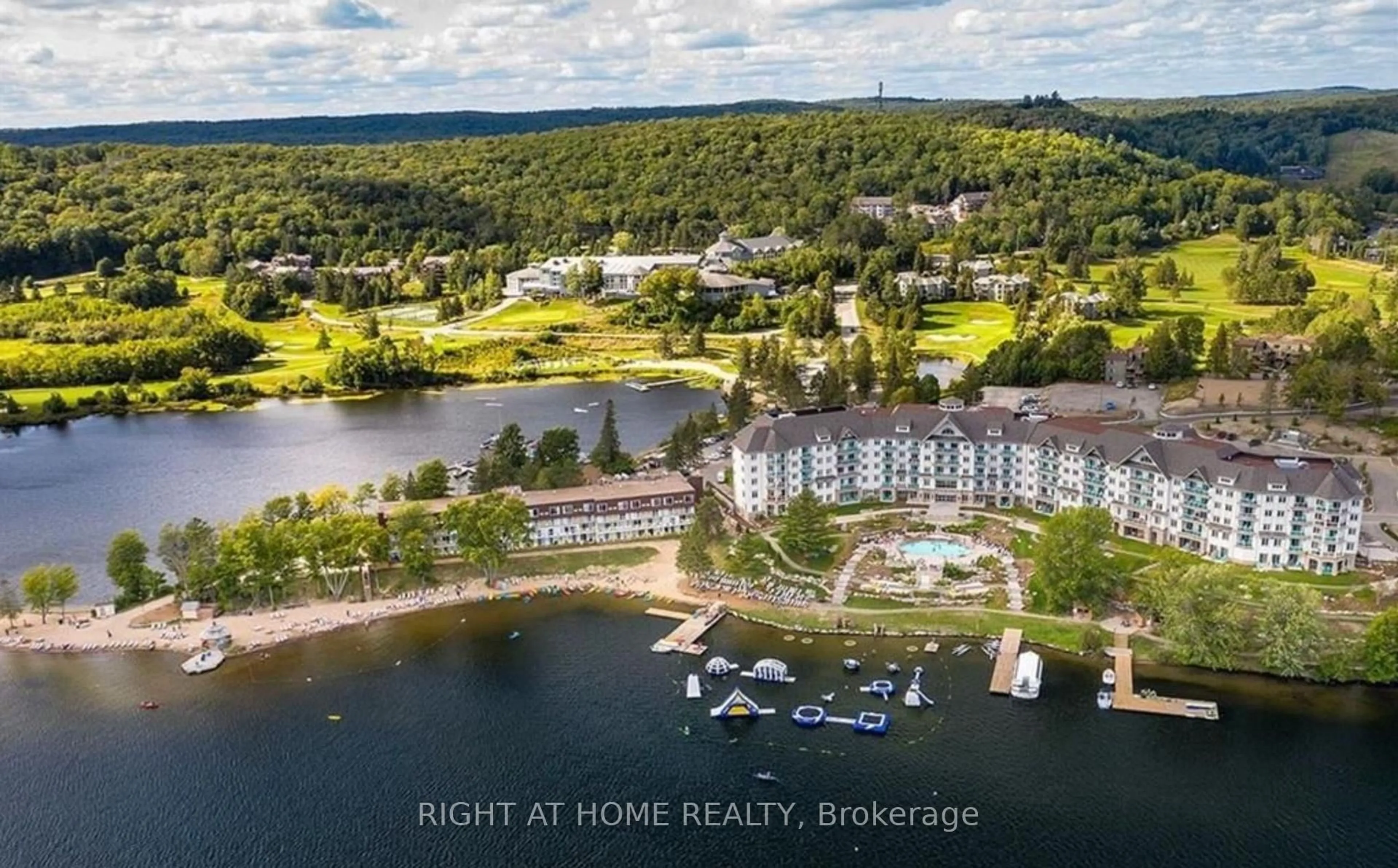 A pic from outside/outdoor area/front of a property/back of a property/a pic from drone, water/lake/river/ocean view for 1235 Deerhurst Dr #210, Huntsville Ontario P1H 2E8