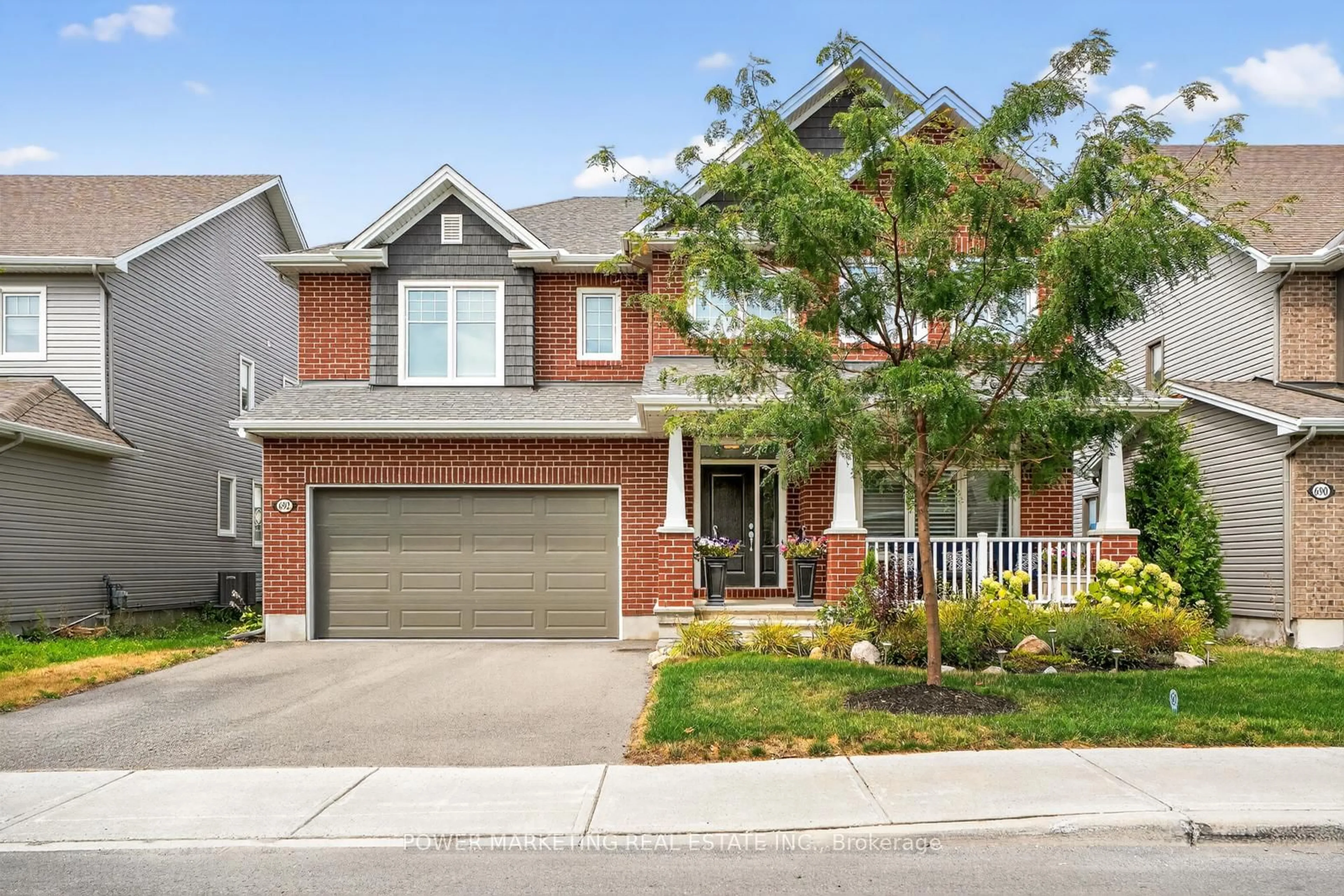 Home with brick exterior material, street for 692 EGRET Way, Ottawa Ontario K2J 0X4