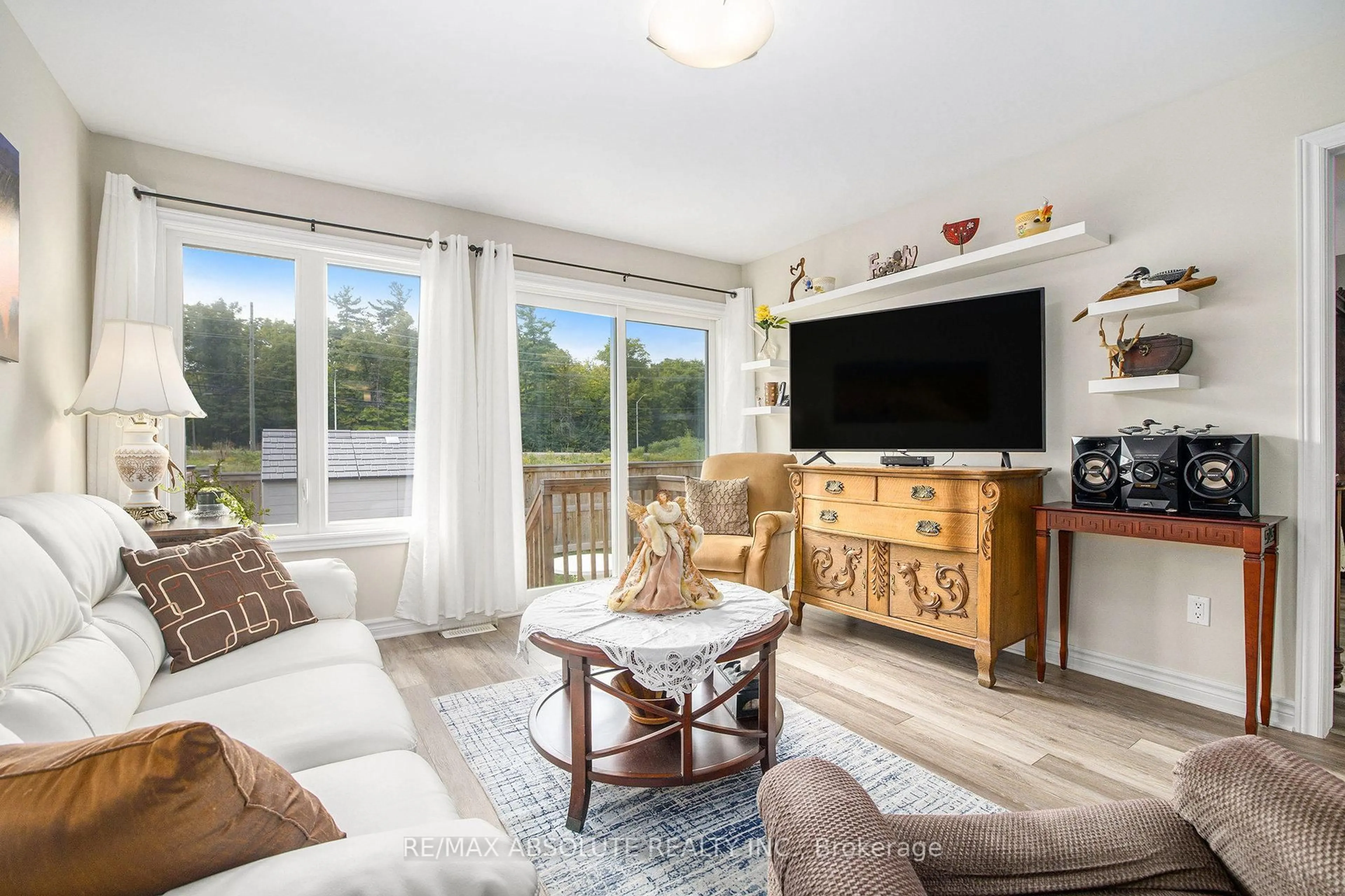 Living room with furniture, wood/laminate floor for 2 Morgan Clouthier Way, Arnprior Ontario K7S 0H9
