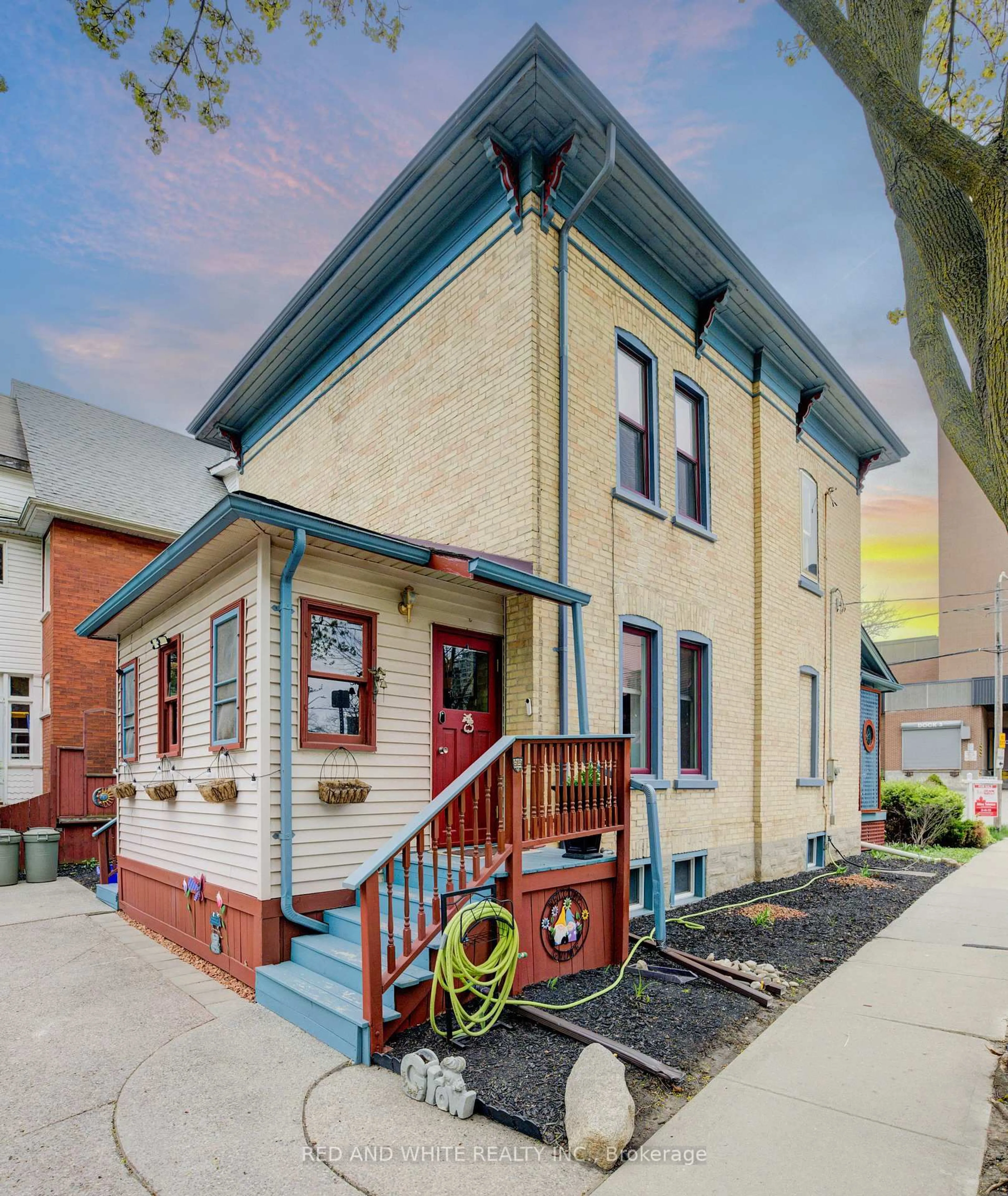 Home with brick exterior material, street for 32 Ellen St, Kitchener Ontario N2H 1L4