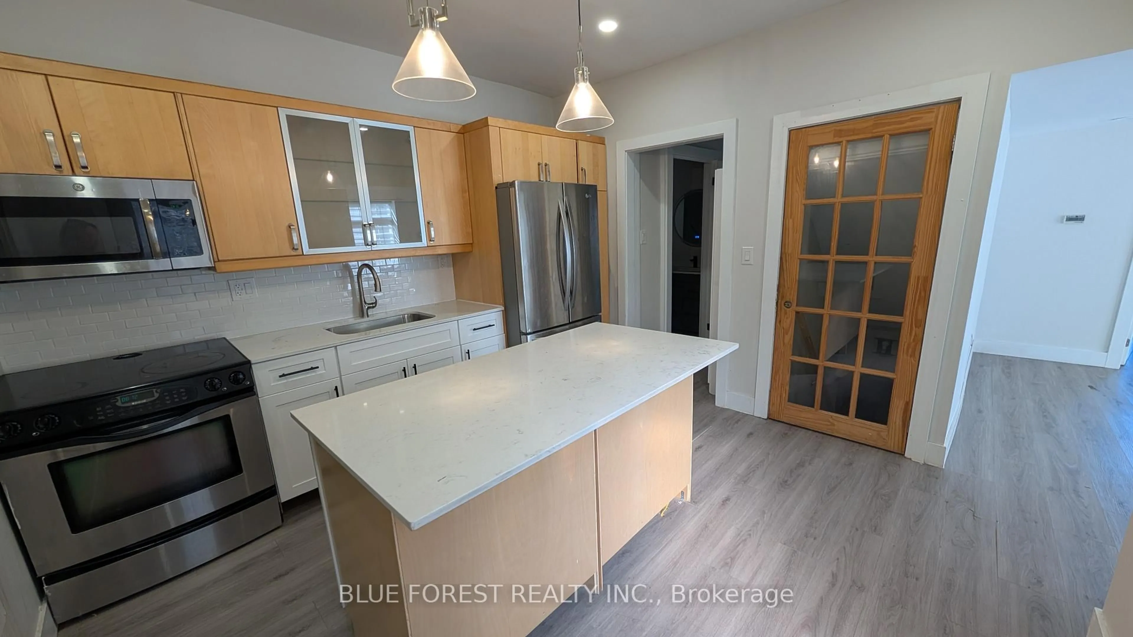 Open concept kitchen, wood/laminate floor for 94 Stanley St, London South Ontario N6C 1B1