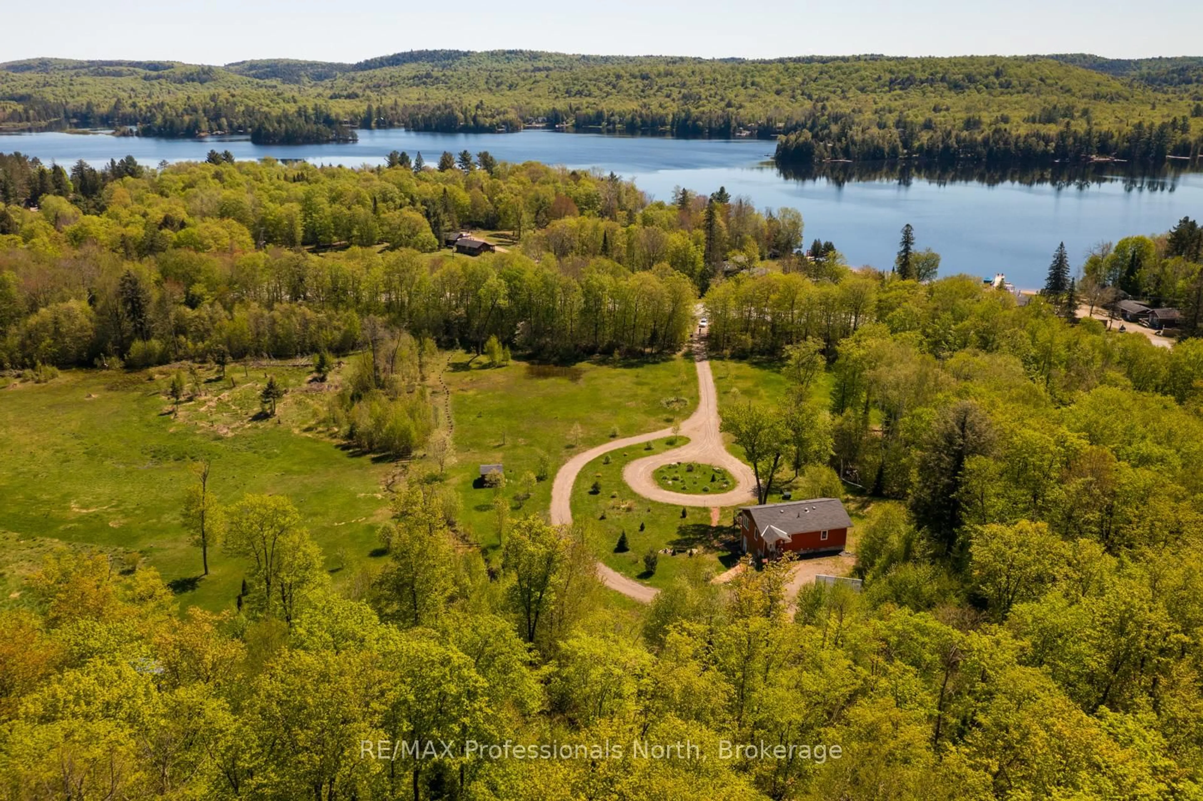 A pic from outside/outdoor area/front of a property/back of a property/a pic from drone, water/lake/river/ocean view for 4043 Highway 60, Algonquin Highlands Ontario P0A 1H0